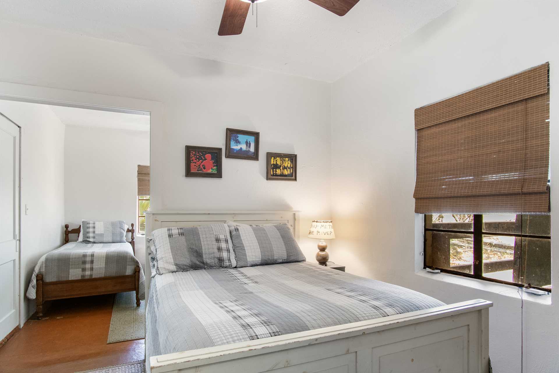                                                 There's a multiple bed setup in the fourth bedroom, with one double and two twin beds, all covered with clean linens.