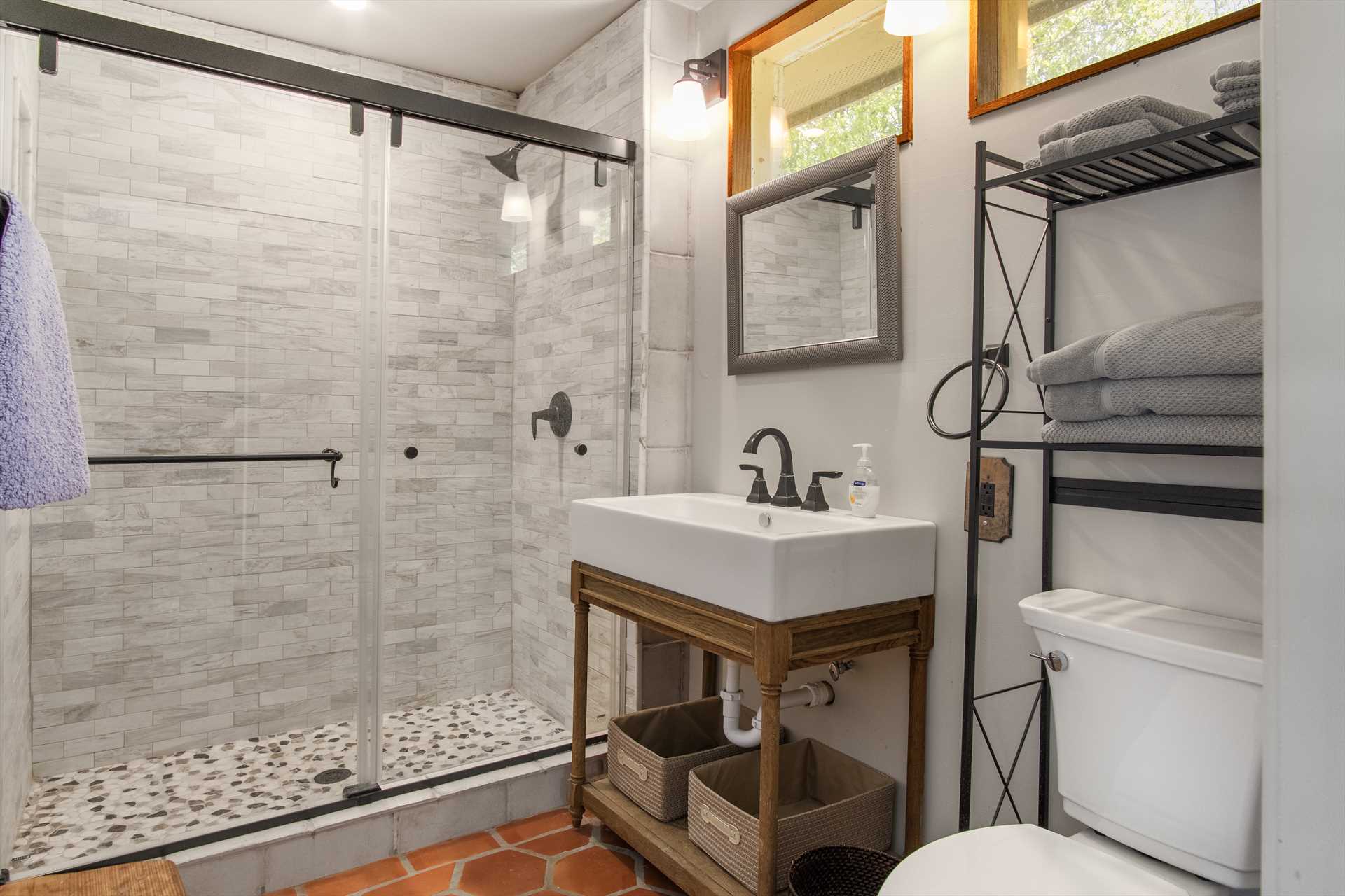                                                 Here's the third full bath at Casa del Rio, this one with a sharp and modern walk-in shower.