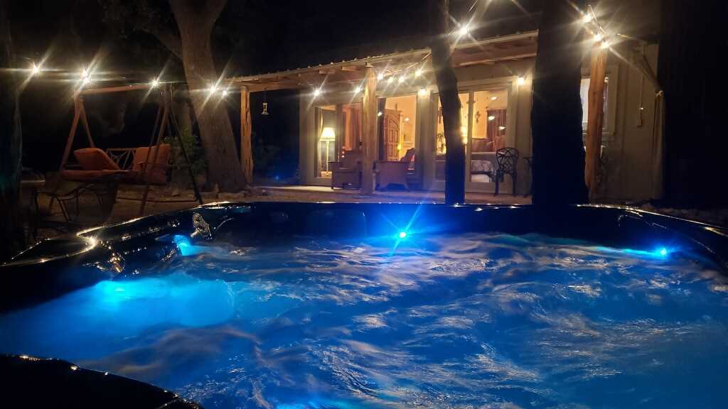                                                 Sparkling outdoor lighting and mellow lights under the water make the hot tub a magical place at night!