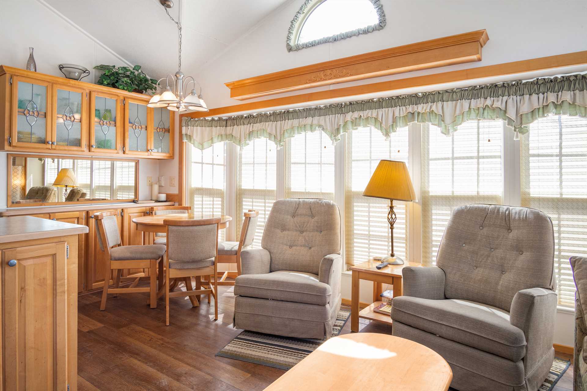                                                 The bright and cozy living room and dining area in the cabin make it just the right size for up to four guests!