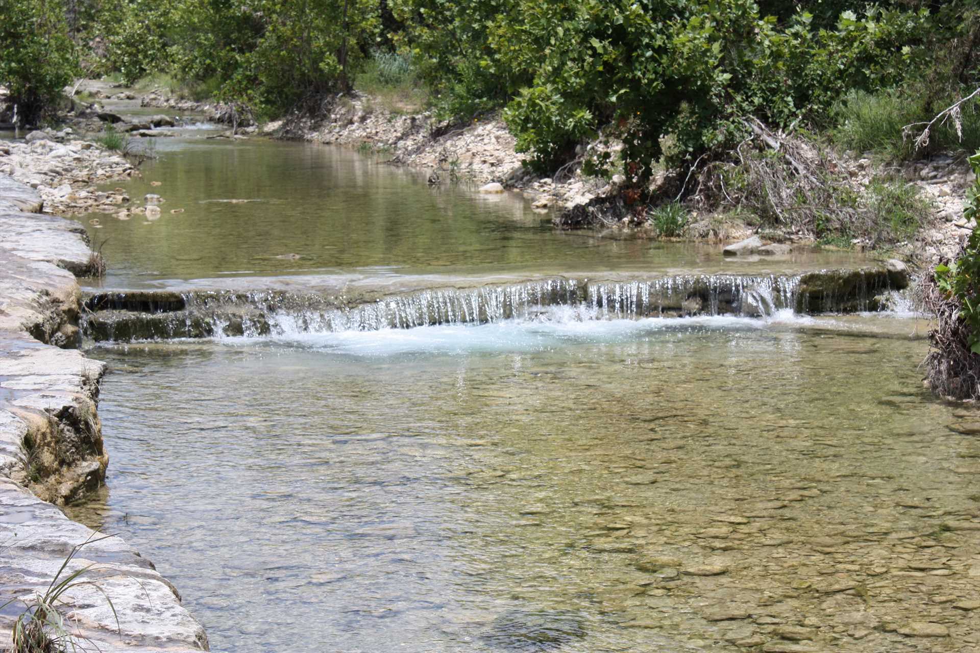                                                 Gentle falls in the creek create a soothing sound experience as you stroll along its banks.