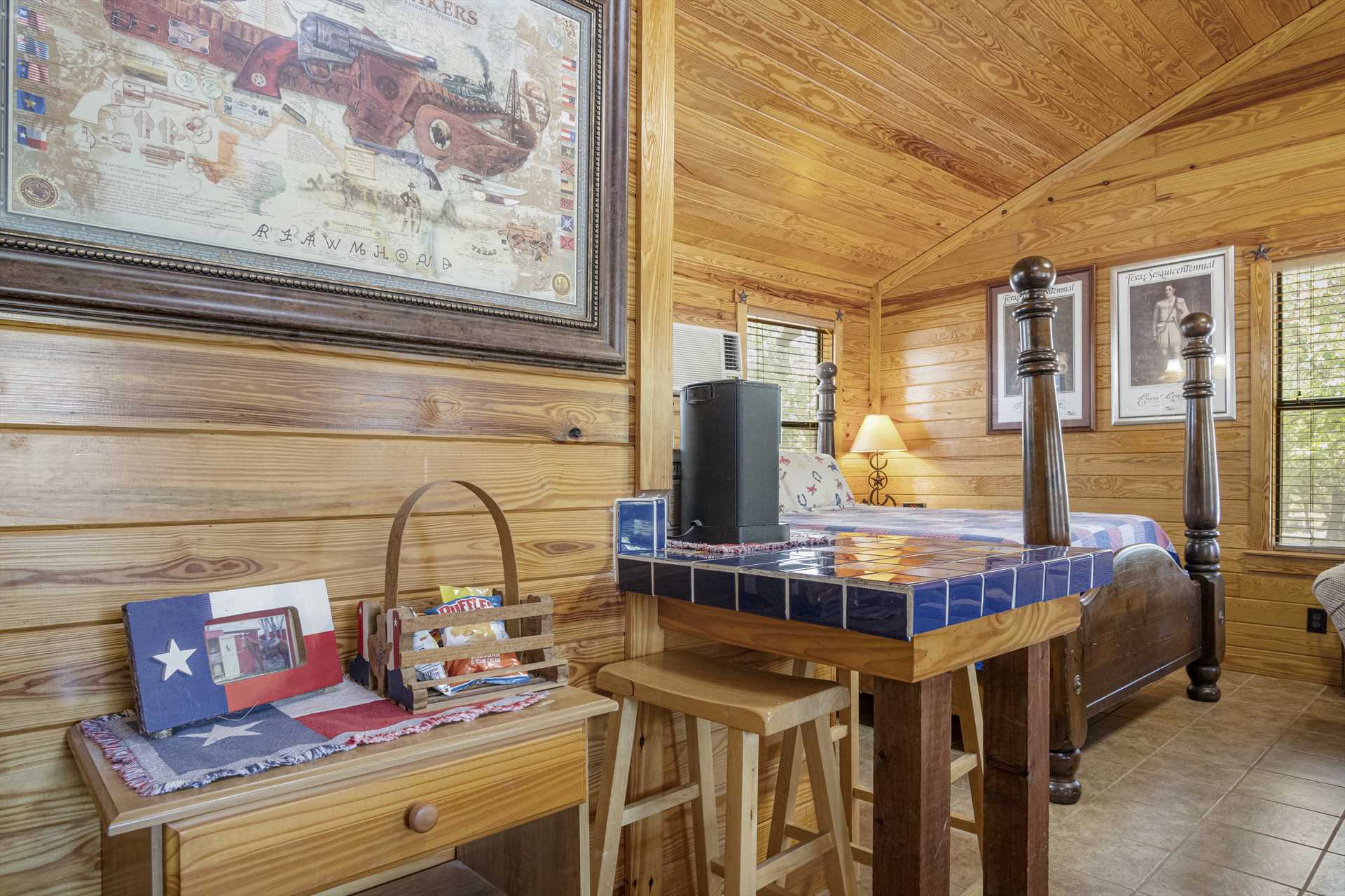                                                 The warm and friendly decor of the cabin creates not only a comfortable environment, but one that celebrates the Lone Star State!