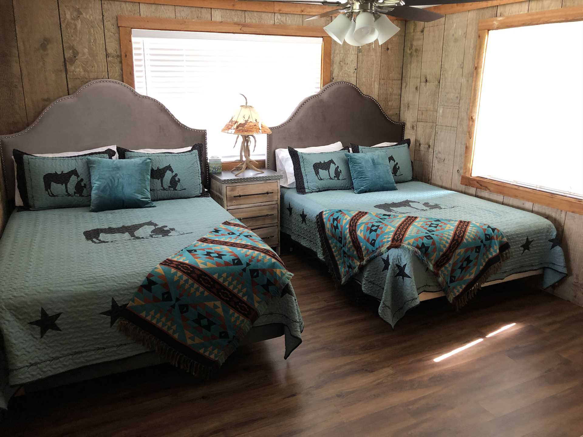                                                 A nicely-matched pair of queen-sized beds grace the second bedroom at the Bluff House, and with a queen sleeper sofa downstairs, the house itself sleeps up to eight people.