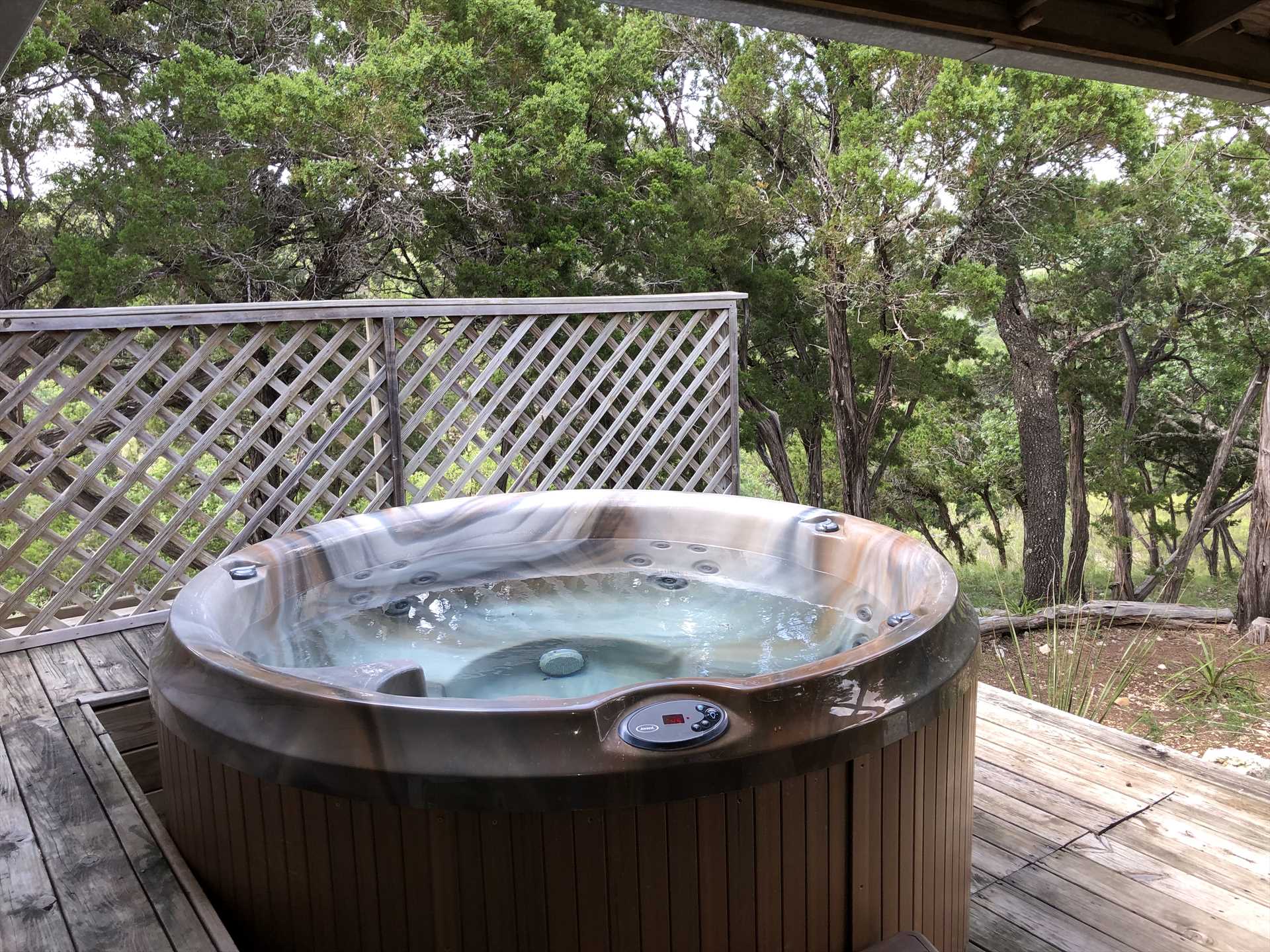                                                 The Retreat's Love Shack has a cool and shaded deck, not to mention an intimate and private hot tub!