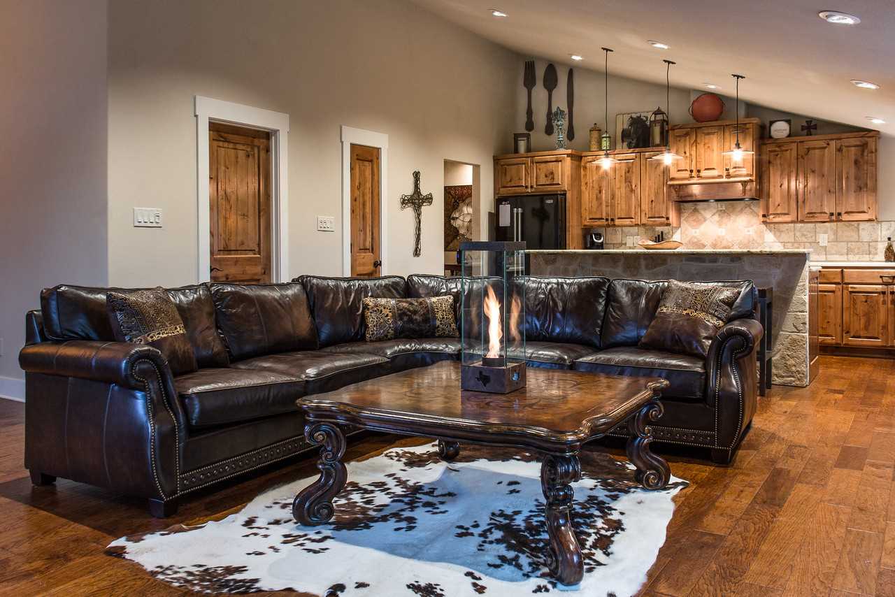                                                 The open floor plan of the Barndominium's main floor makes it an ideal gathering spot, all in the comfort provided by central air and ceiling fans.