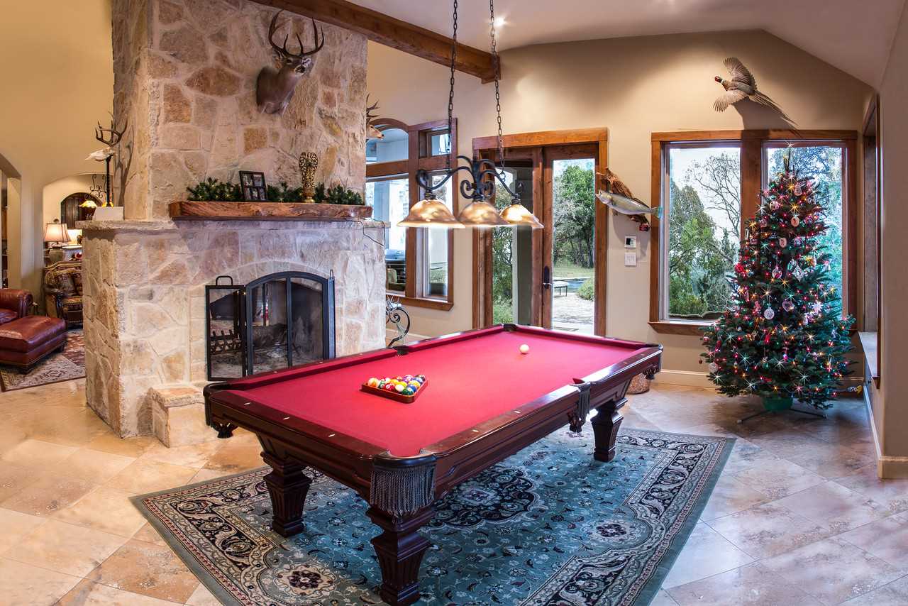                                                 Among the fun amenities you'll find in the Summit House are a vintage pool table, and a back-to-back fireplace that heats two rooms.