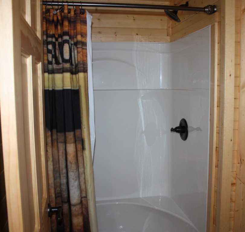                                                 Put a shine on your day in the shower-tub combo in the cabin's full bath!