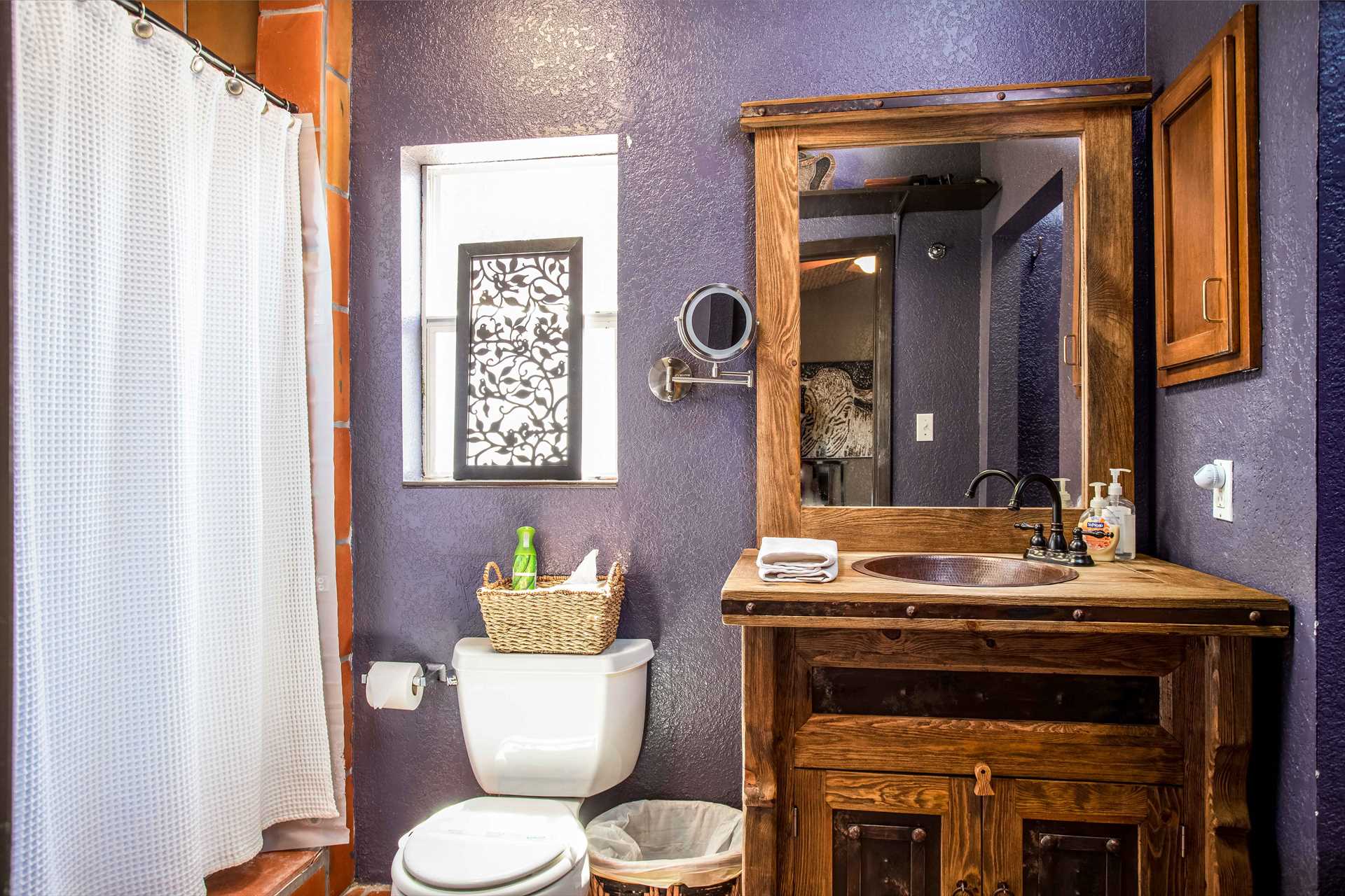                                                 An amazing and rustic wooden vanity graces the full bath, as well as a sparkling clean shower stall, and plenty of clean linens!