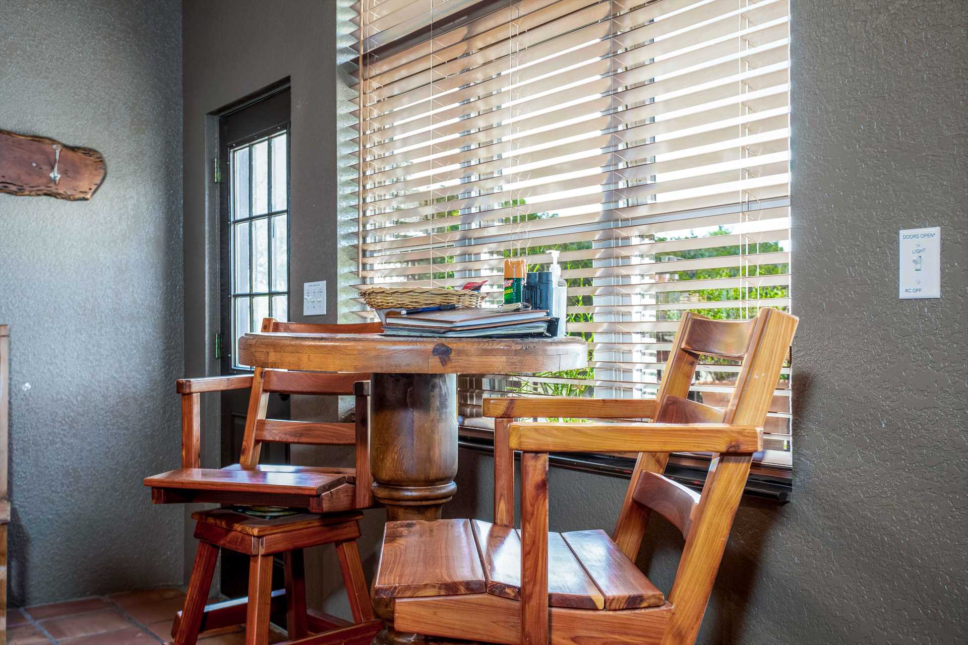                                                Bar-style seating at a convenient window-side table makes the perfect setting for a cozy breakfast nook.