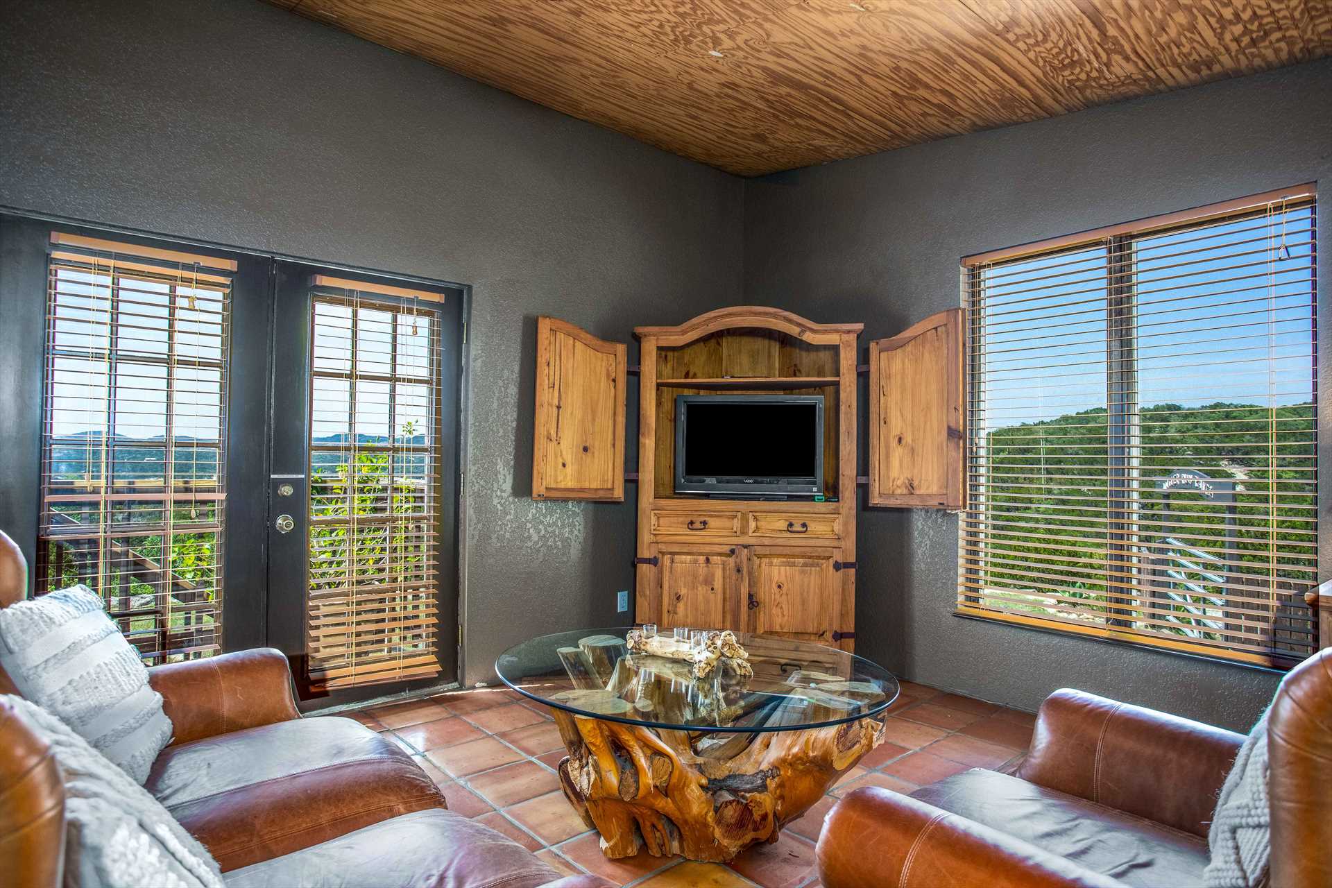                                                 Even while enjoying movie night, you'll have access to amazing mountain views with the plentiful windows at the cabin!