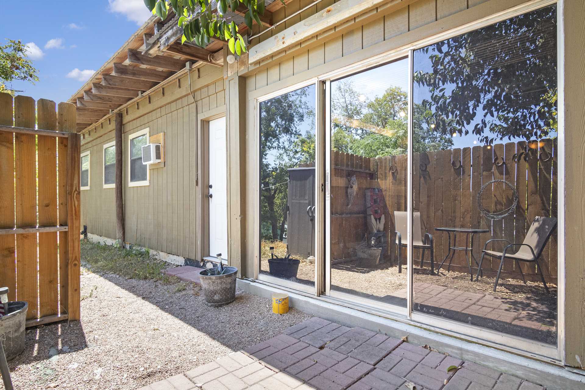                                                 Sliding glass doors allow access to the patio, and let in plenty of natural light, too!