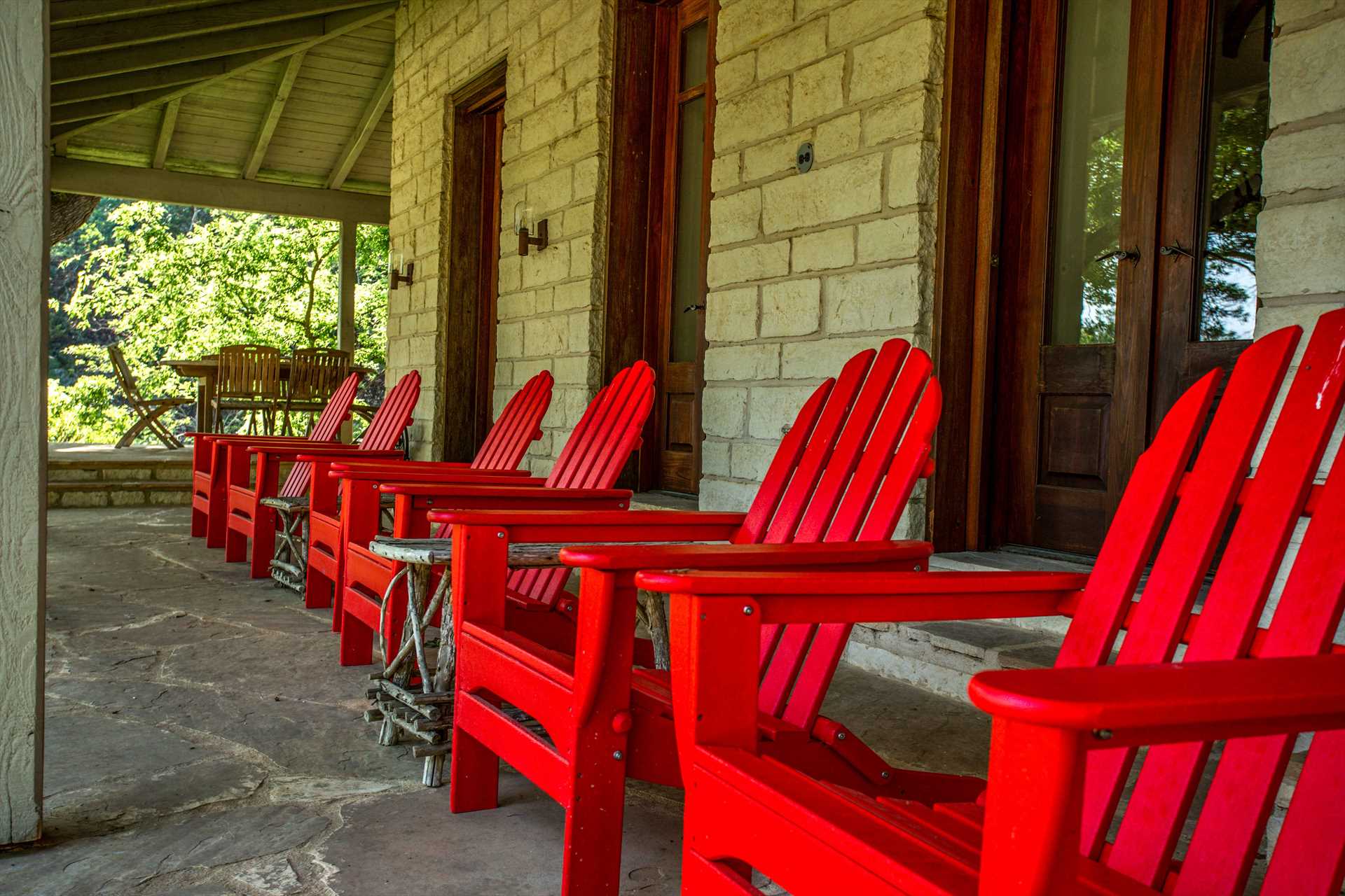                                                 Outdoor furniture adds a dash of color to the Homestead's shaded patio, as well as a comfortable place to relax and enjoy the view!