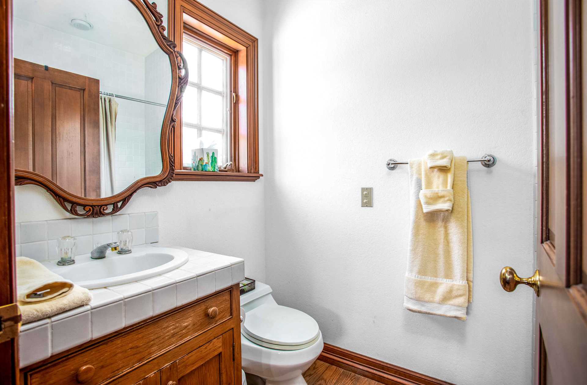                                                 A tub and shower combo, along with clean linens, round out your cleanup space in the Casita's full bath.