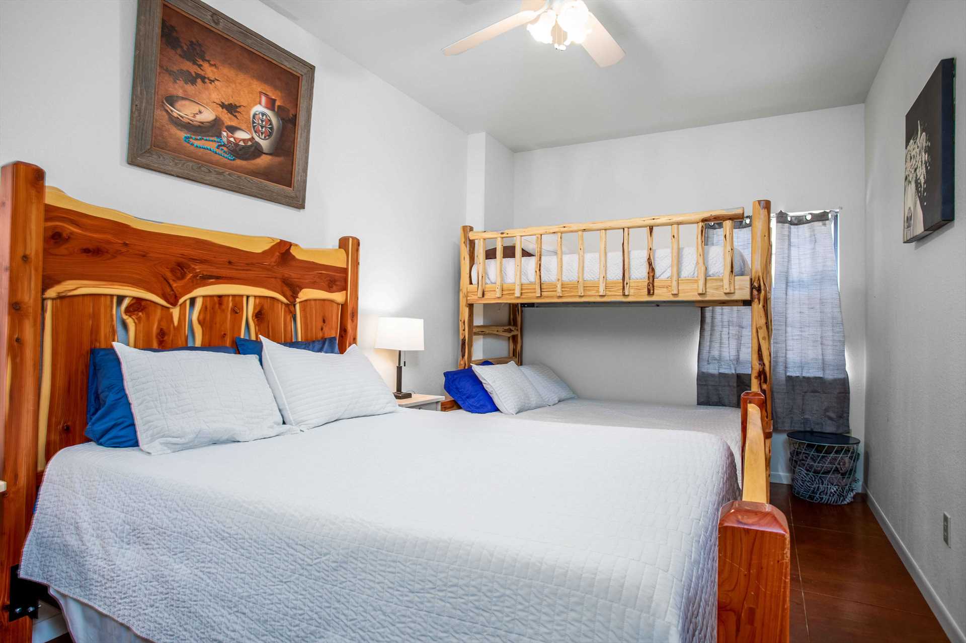                                                 The first of four bedrooms at the Lodge features a roomy queen-sized bed and a twin/full bunk bed setup. Clean linens for all sleeping spaces are provided, too!