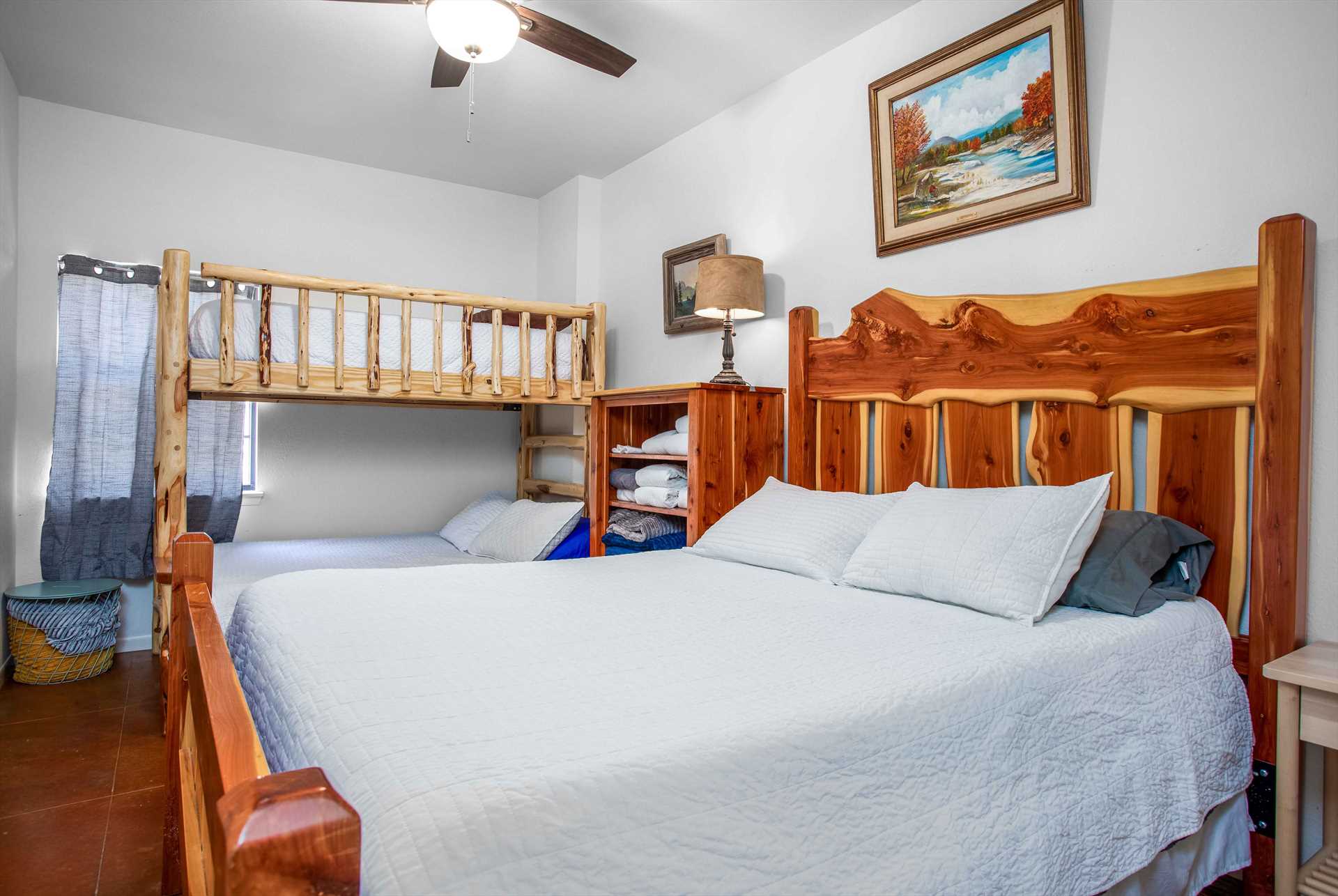                                                 You'll find another queen-sized bed and twin/full bunk set in the second bedroom. All the beds here are framed in sturdy and unique woodwork!