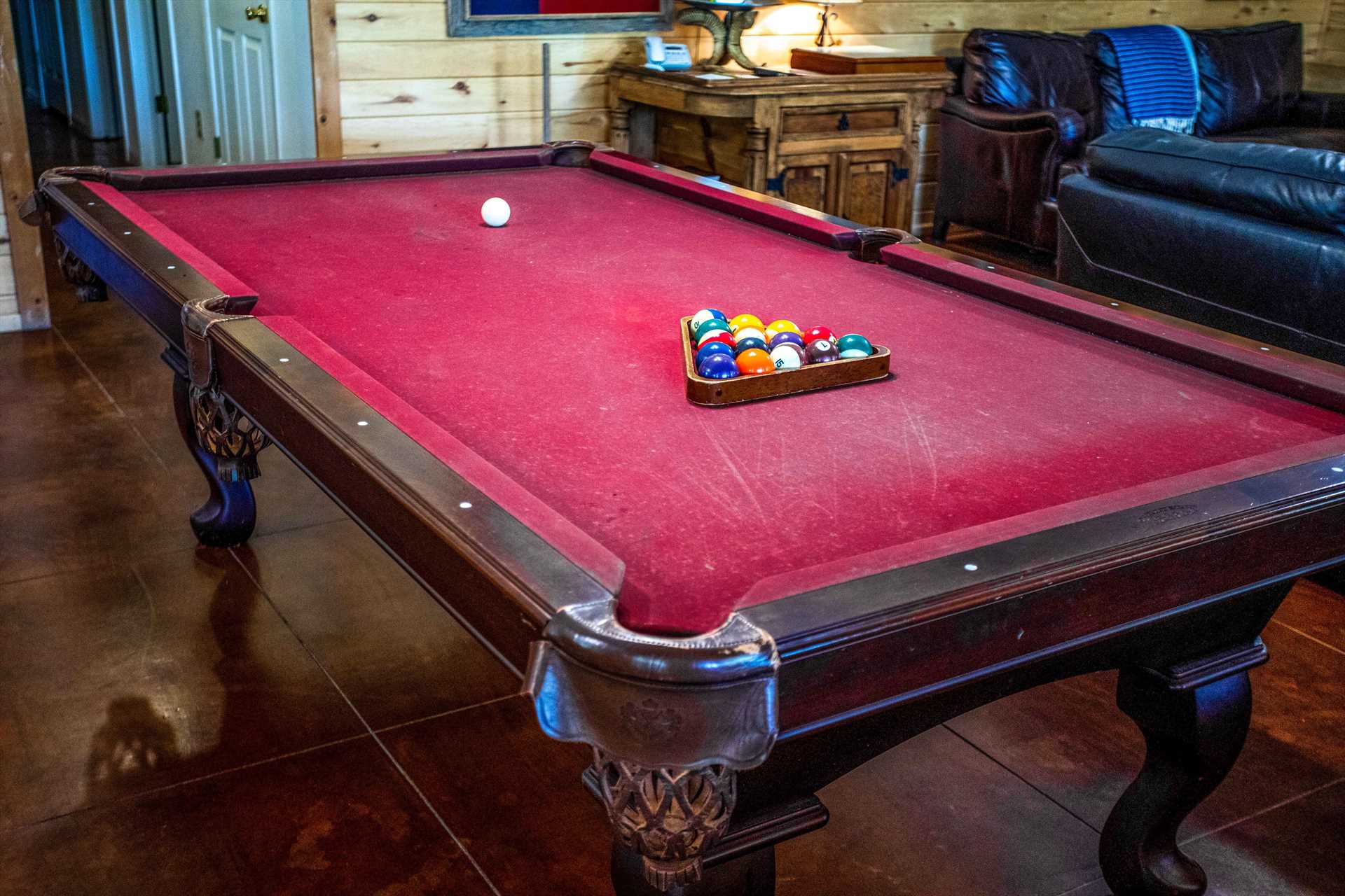                                                 Hone your billiards skills around this big and beautiful old-style drop-pocket pool table!