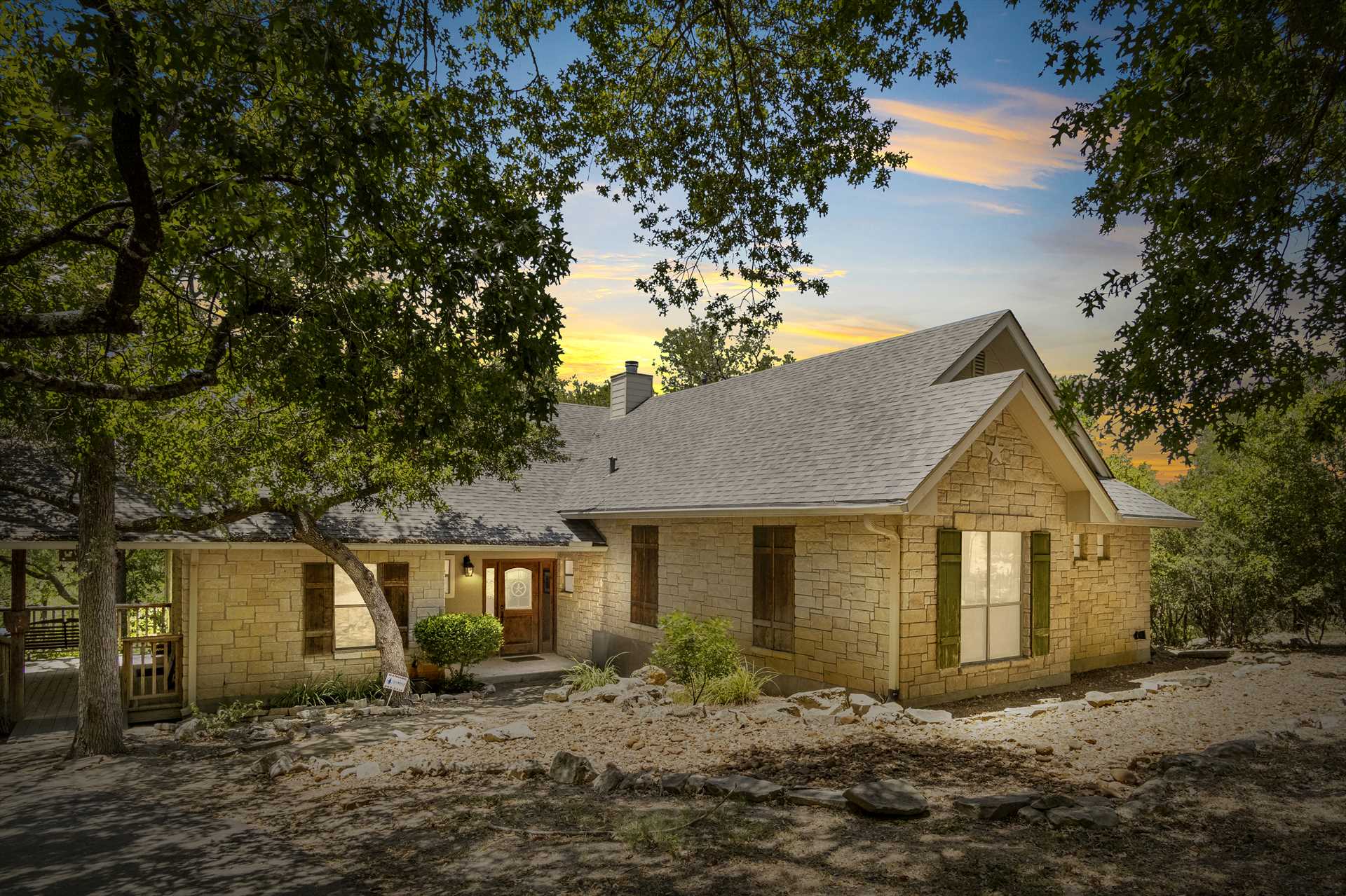                                                 The landscaping and construction of the Guadalupe River Retreat make it look right at home in its riverside setting.