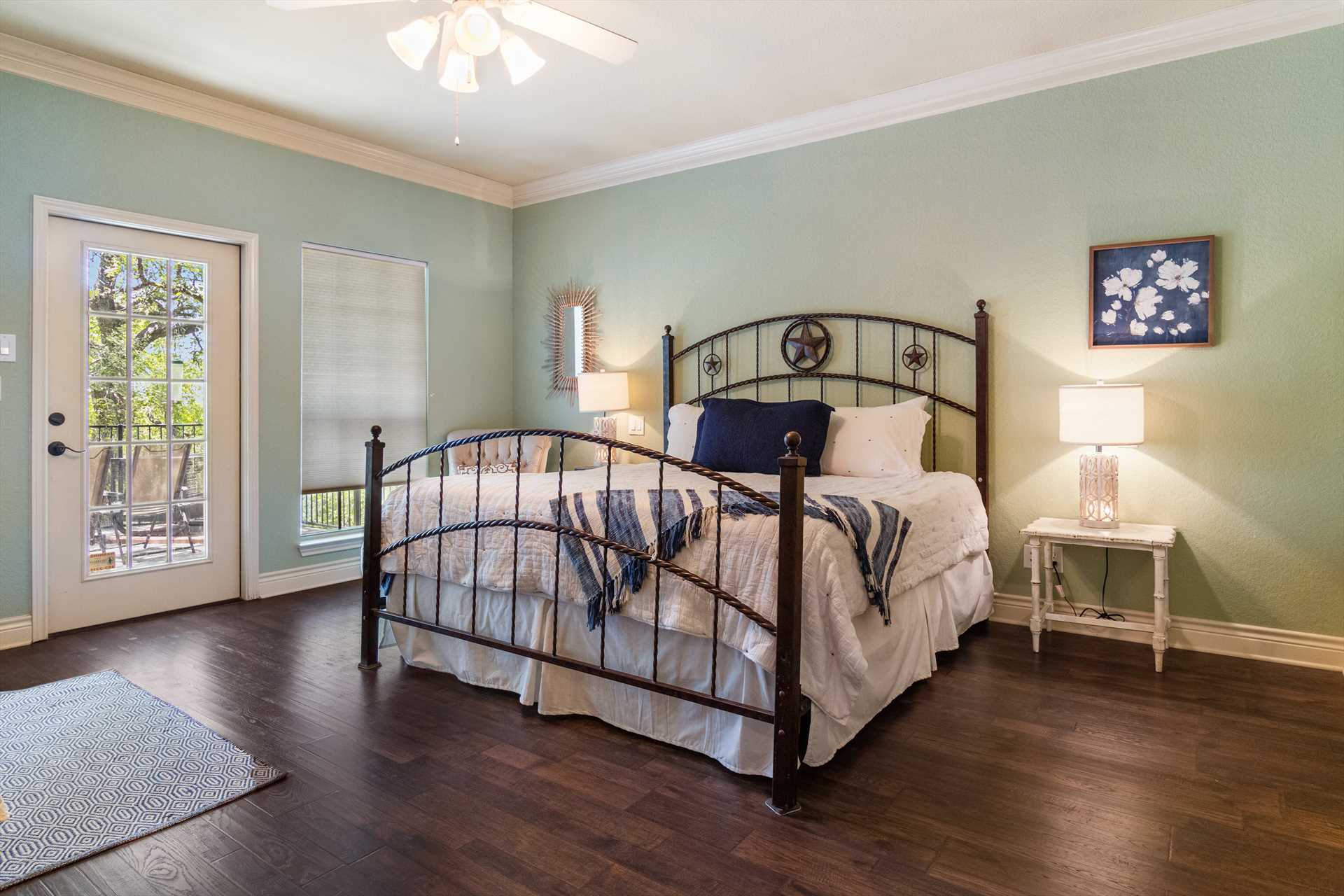                                                 A plush and comfy king-sized bed, draped in clean linens, can be found in the master bedroom, along with a day bed.