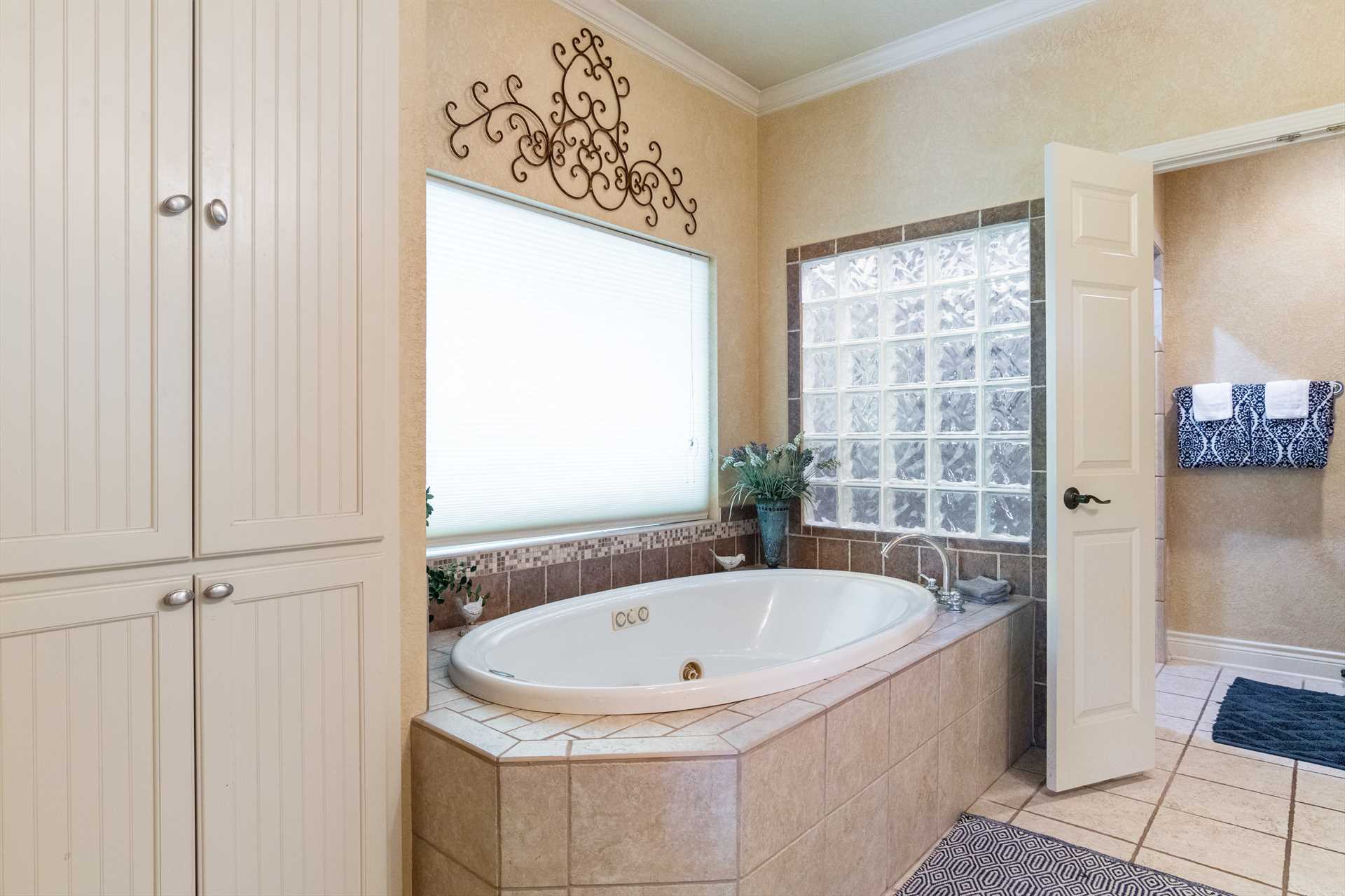                                                 The roomy and soothing Jacuzzi tub is the centerpiece of the master bath!