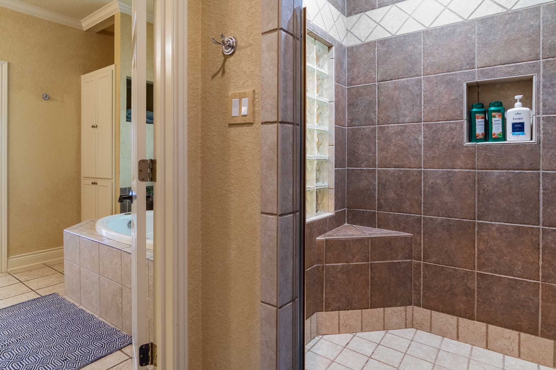                                                 Just beyond the Jacuzzi in the master bath, you'll also find a spacious and luxurious walk-in shower.