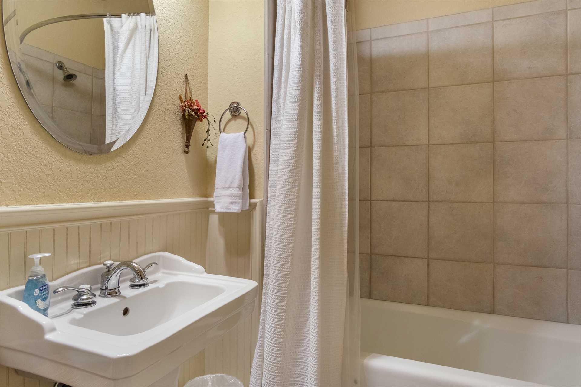                                                 The second full bath at the Retreat features a spotless shower and tub combo.