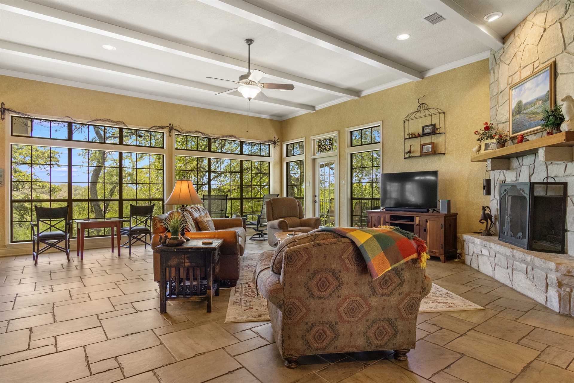                                                 You don't have to go outside for breathtaking Hill Country views! Look at the panorama you can see from the living area.