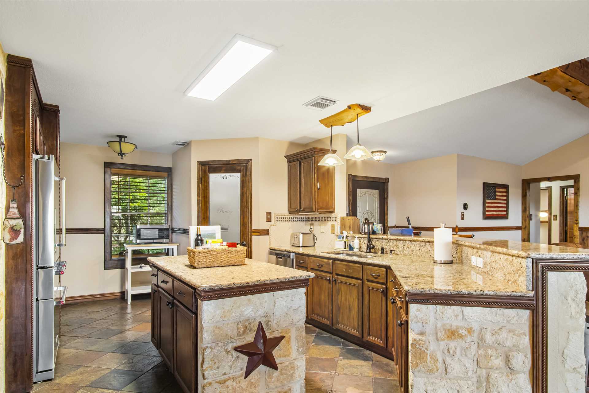                                                 Modern appliances and plenty of counter space make the kitchen a cook's paradise!