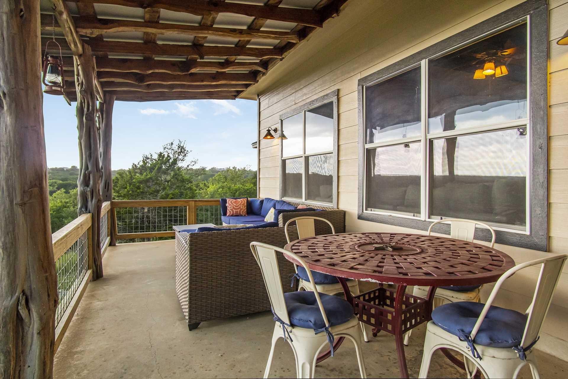                                                 Comfortable seating on the shaded patio gives you incredible Hill Country views from your mountain perch!