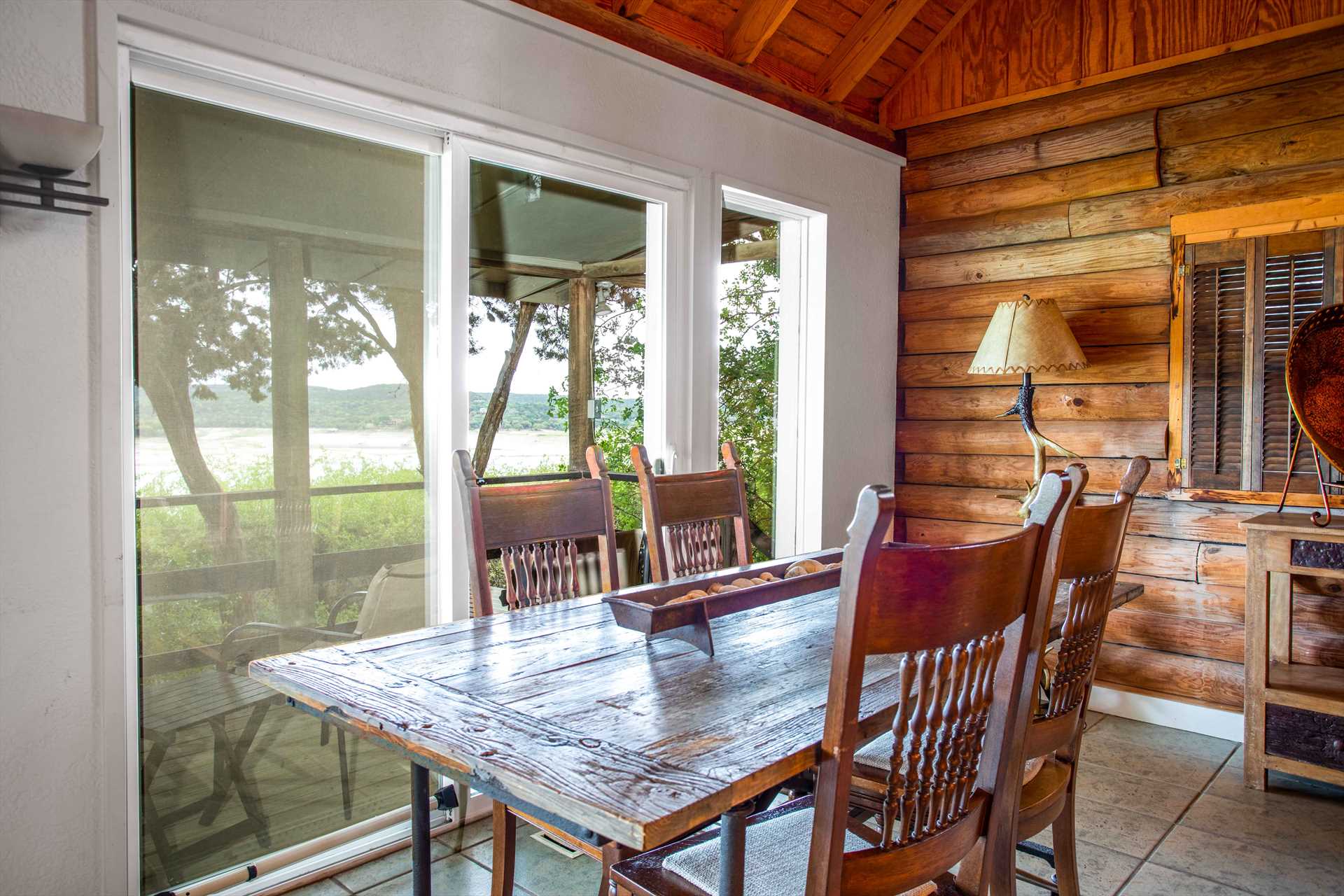                                                 Plenty of windows facing the back deck give you access to inspiring lake views from inside, too!