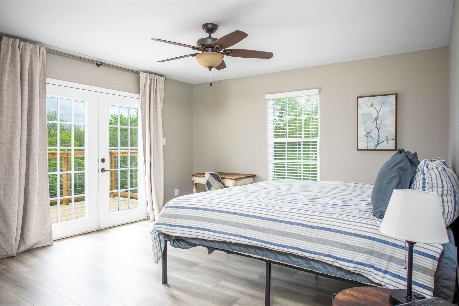                                                 French doors lead from the master bedroom to a private deck! Also featured is a great big king-sized bed.