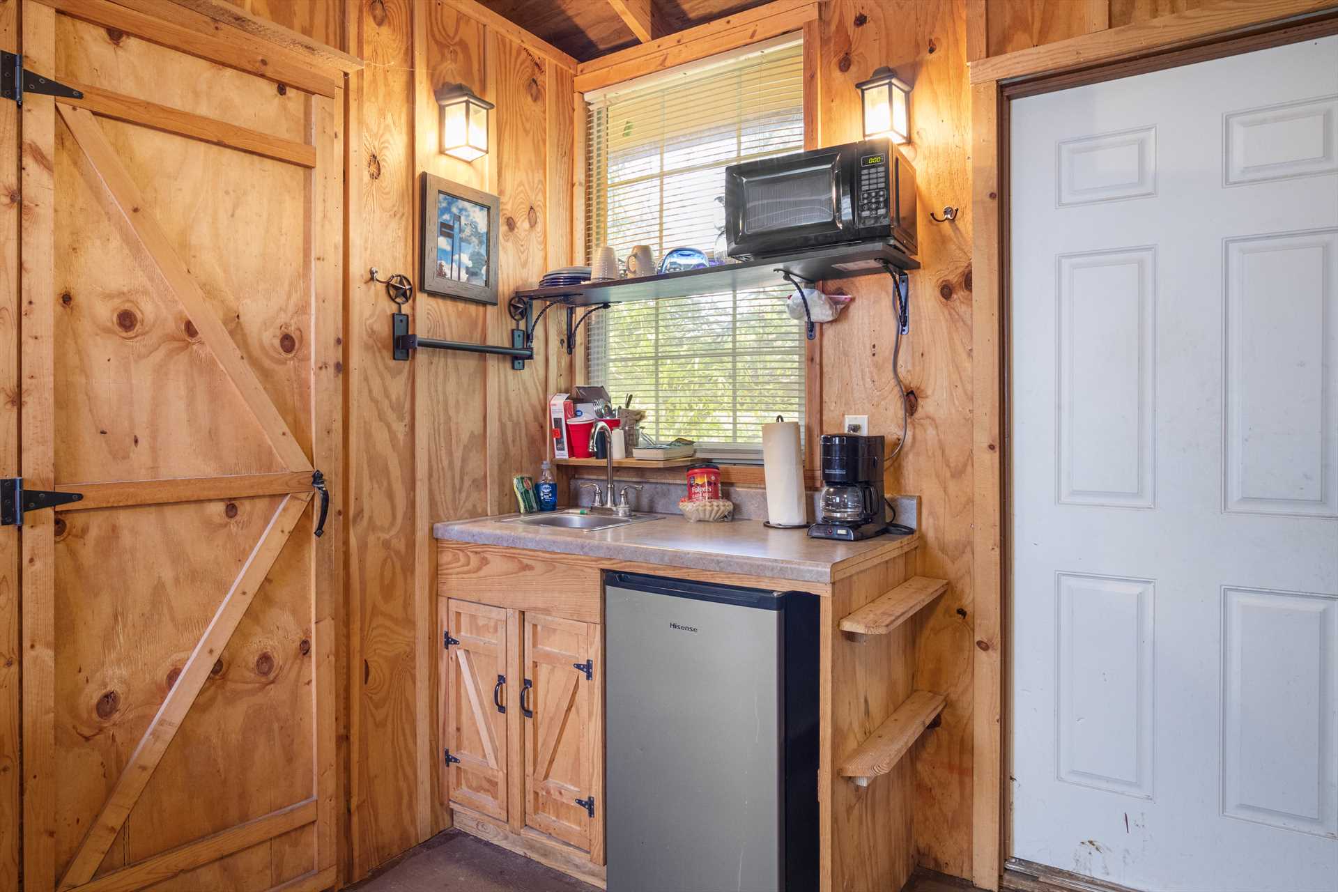                                                 Your cozy kitchenette includes a mini-fridge, microwave, and coffee maker...and don't forget Kerrville is close by, too!