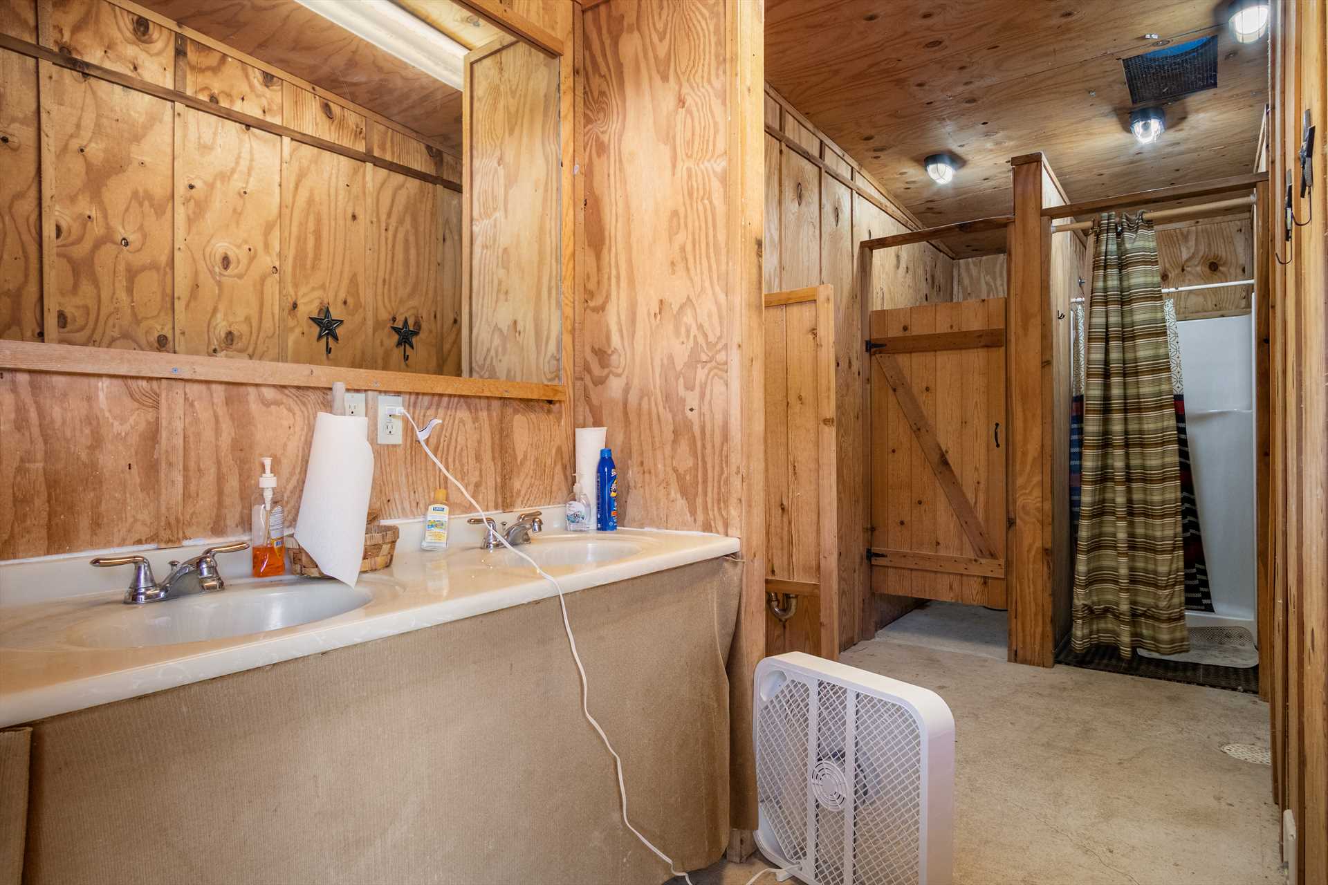                                                 A large vanity with ample counter space is included in both the men's and women's sides of the River Run bath house.
