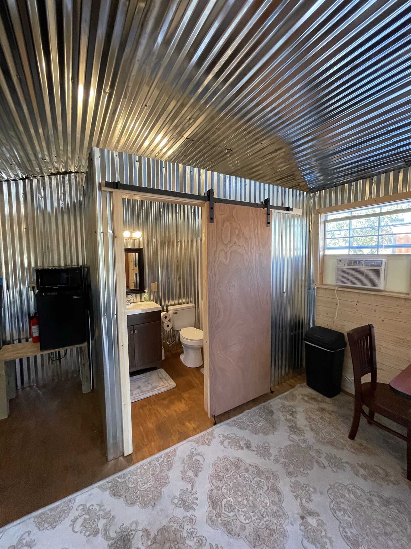                                                 The cabin's kitchenette includes a mini fridge, microwave, and complimentary K-Cup coffee!