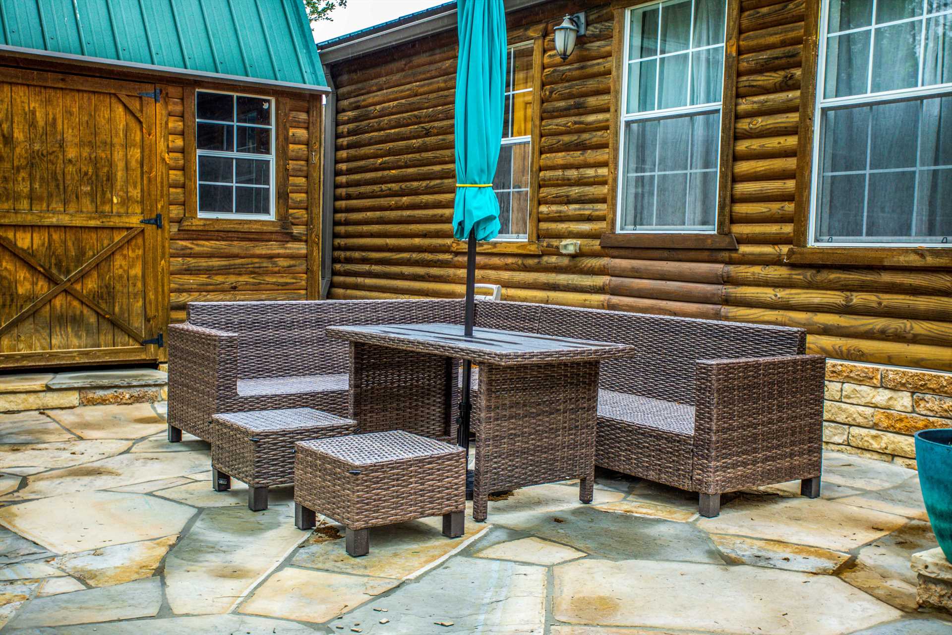                                                 Pop the umbrella for a shady hangout on the cabin's comfy outdoor suite!