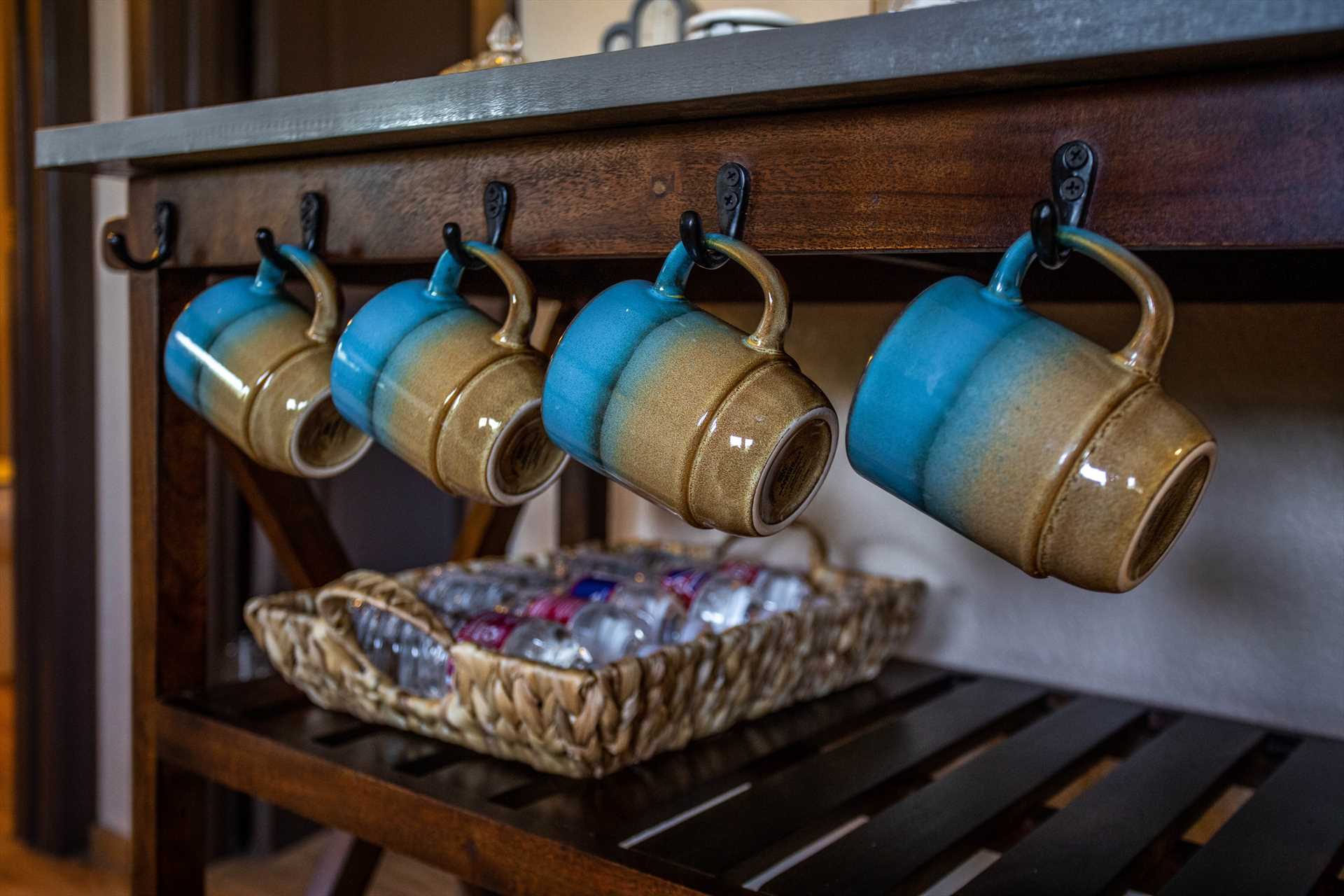                                                 Plenty of pots, pans, serving ware, cups, glasses, and utensils are stocked in the country kitchen, too!