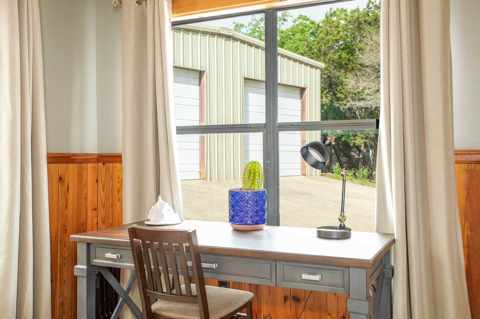                                                 If you need to catch up with the outside world, there's a dedicated window-side workspace right in the master bedroom!