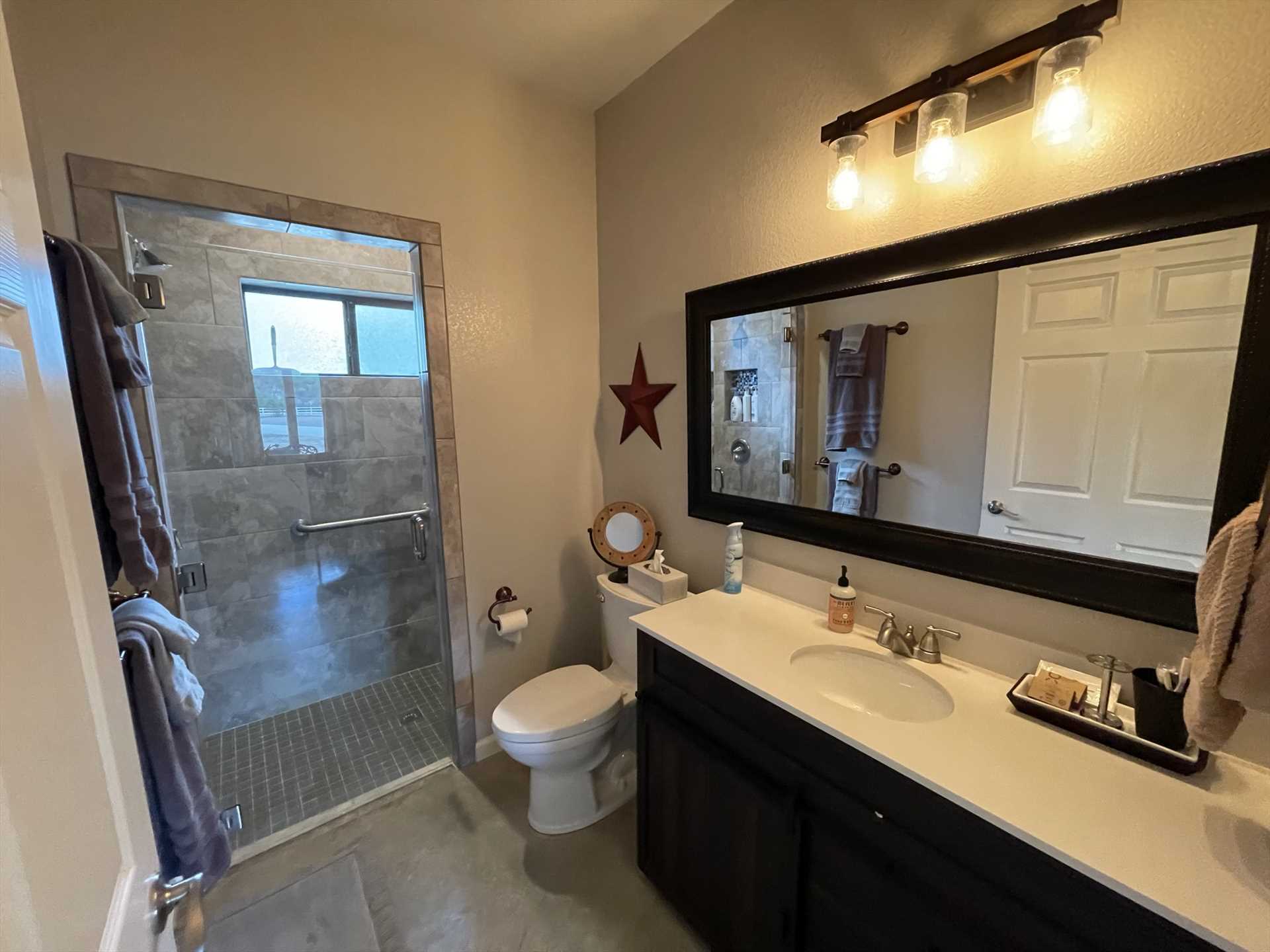                                                 The full bath includes a roomy shower stall, roomy vanity, and plenty of clean linens.
