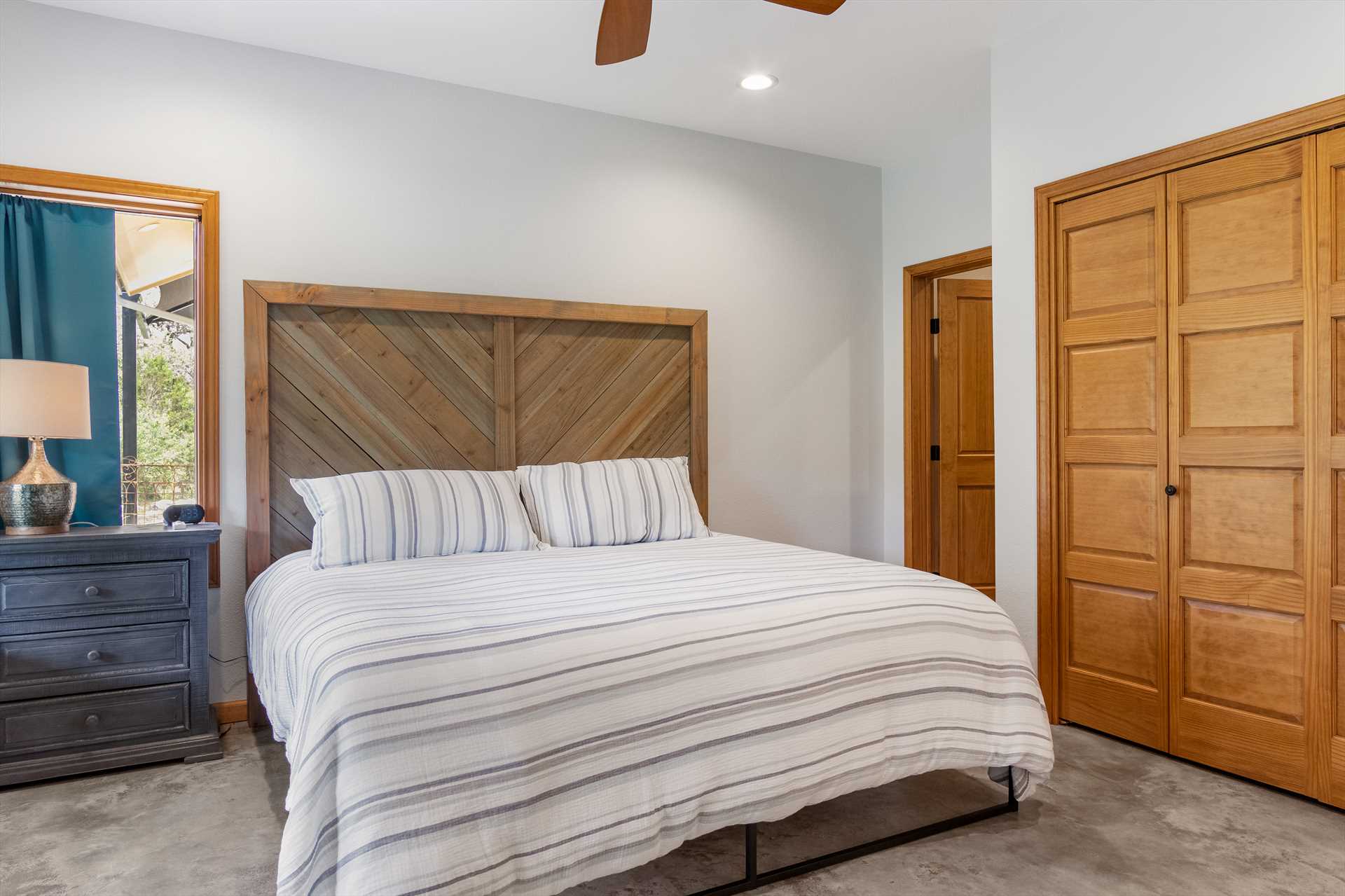                                                 The second master bedroom (yup, there are two!) features a restful and soft king-sized bed.