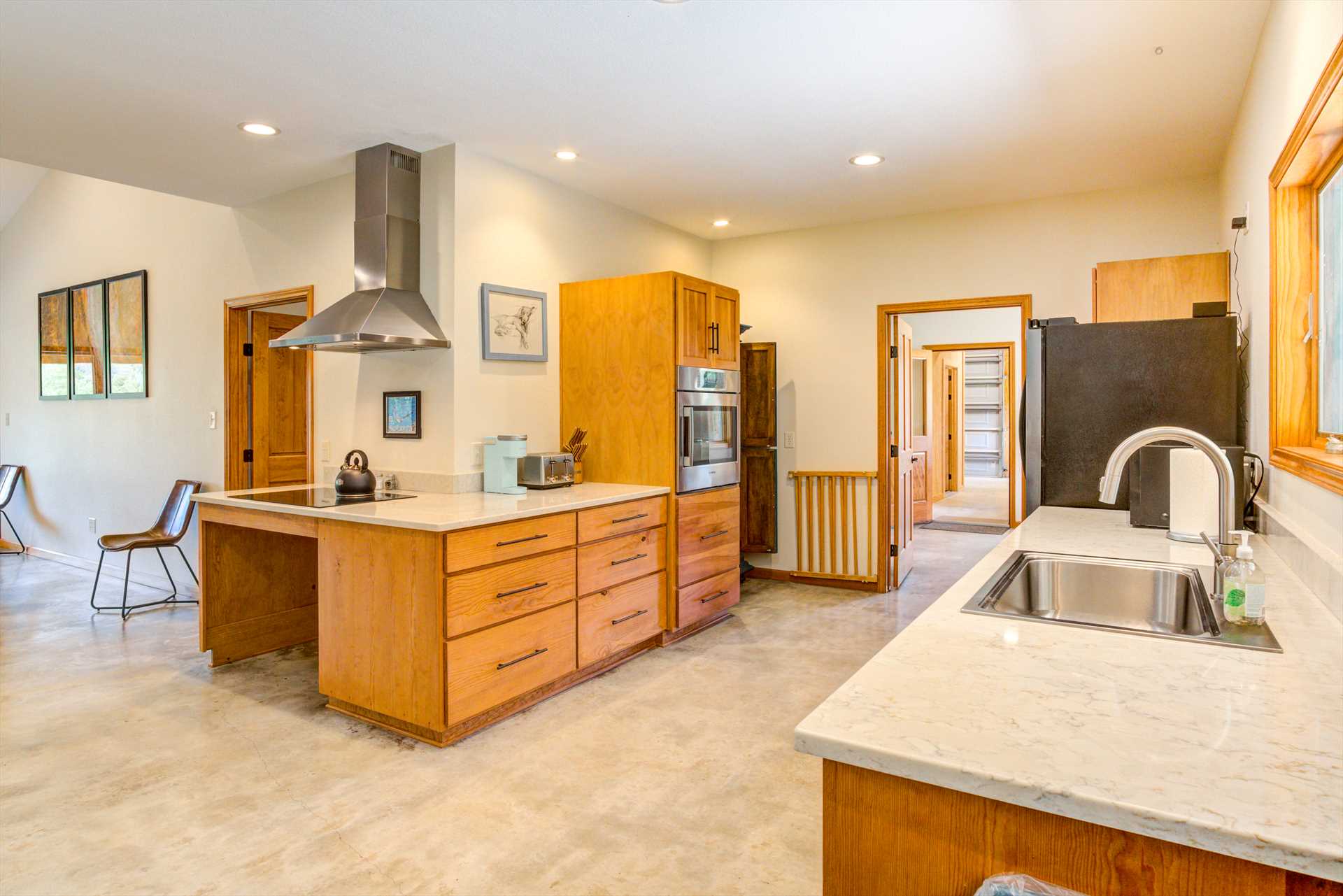                                                 Tons of counter space, modern appliances, cooking and dining ware, utensils, and glasses...the ranch's enormous kitchen has it all!
