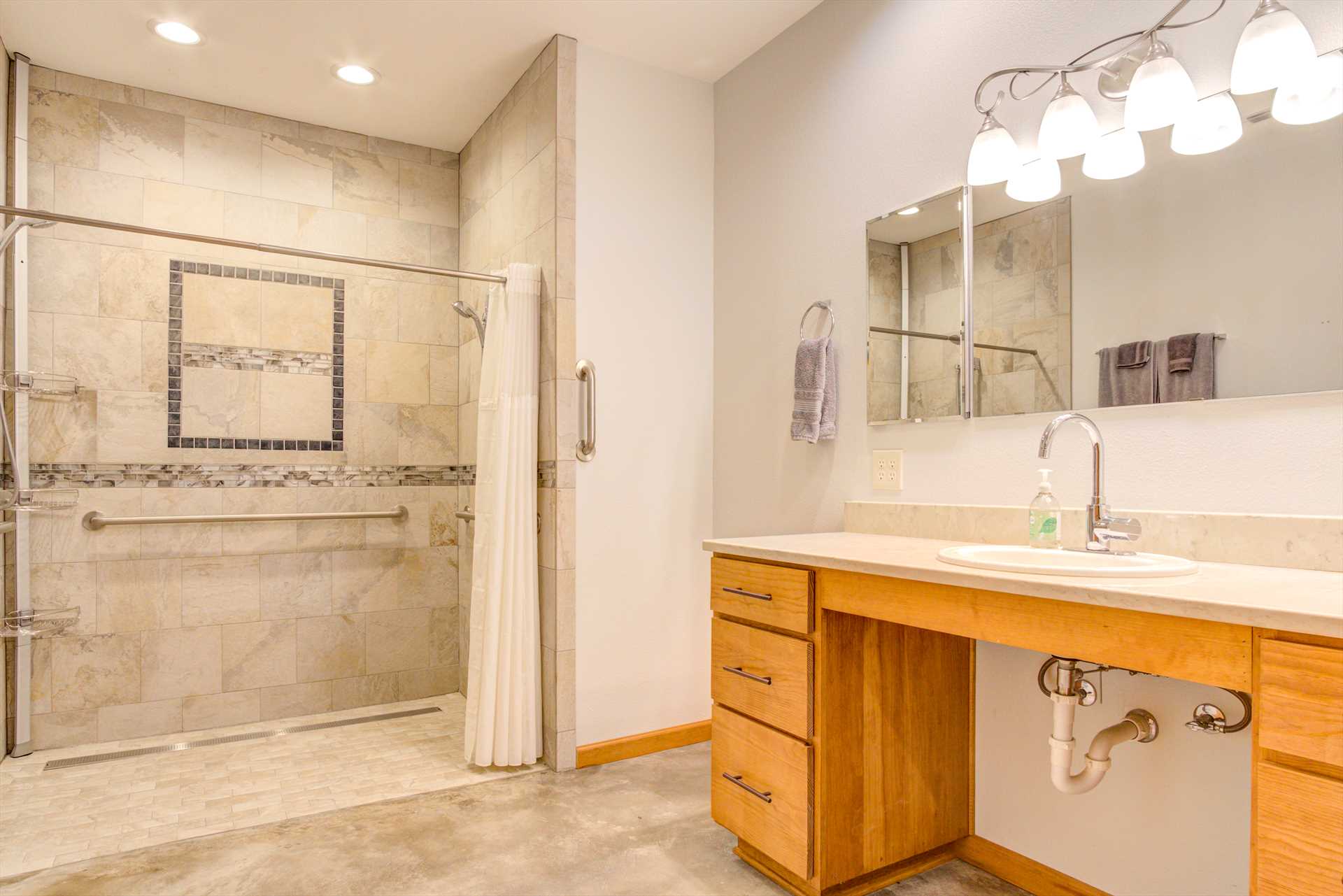                                                 A roomy, easily accessible, and sparkling clean shower is the centerpiece of the master bath.
