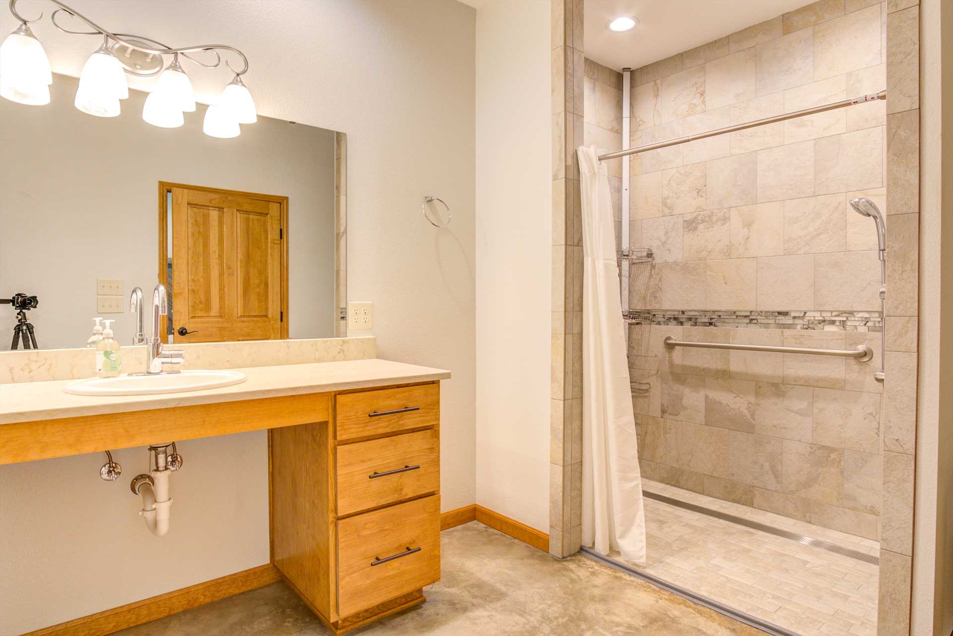                                                 The spacious showers and vanities in both master bathrooms are designed with full ADA compliance.