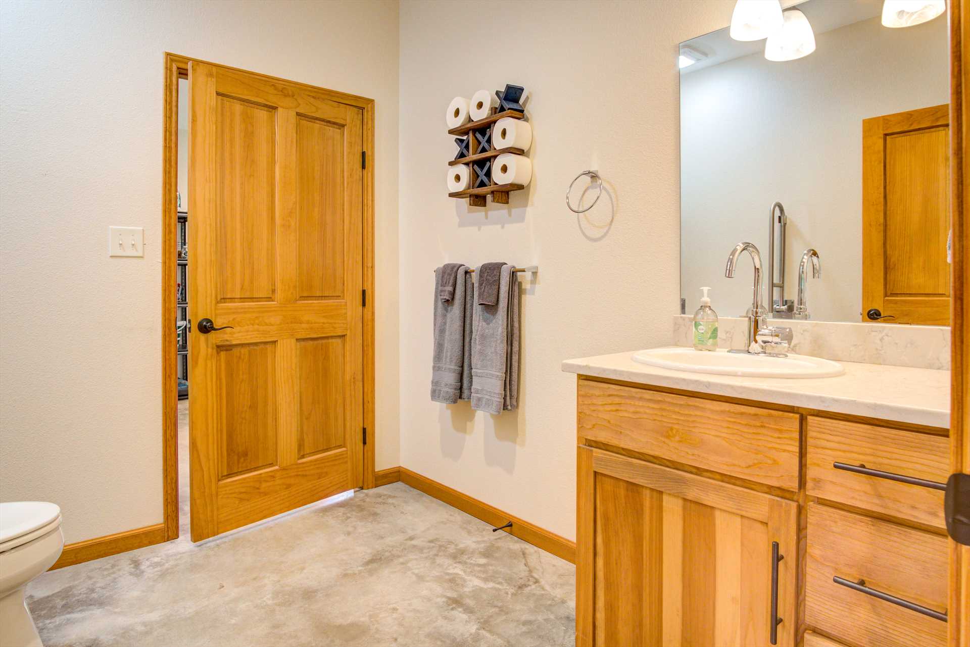                                                 An additional half-bath is located close to the kitchen, dining, and living room areas for your convenience.