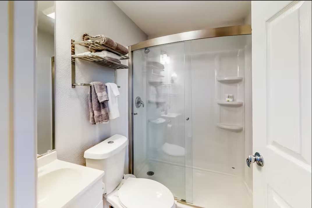                                                 Cleanup is a pleasure in the roomy glass-walled shower stalls at the Retreat. Bath linens are included, too!