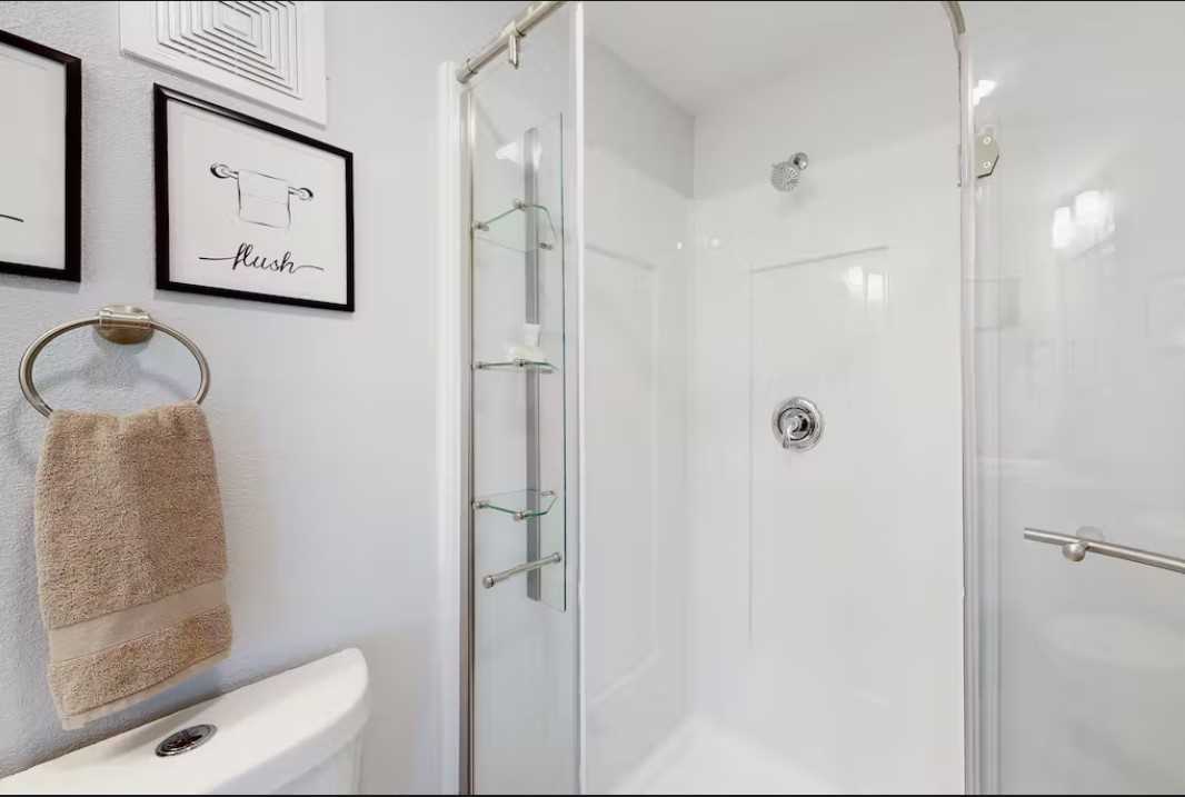                                                 The glass-walled shower stall in the master bath allows for easy cleanup in style!
