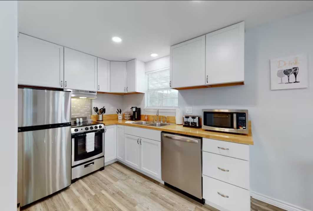                                                 Both kitchens at the Getaway are furnished with gleaming new appliances, including a dishwasher and K-Cup coffee maker.