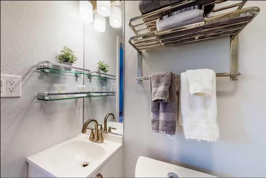                                                 Upstairs and downstairs, you'll find full baths with shower stalls on both sides of the Blue Getaway duplex-four in all!