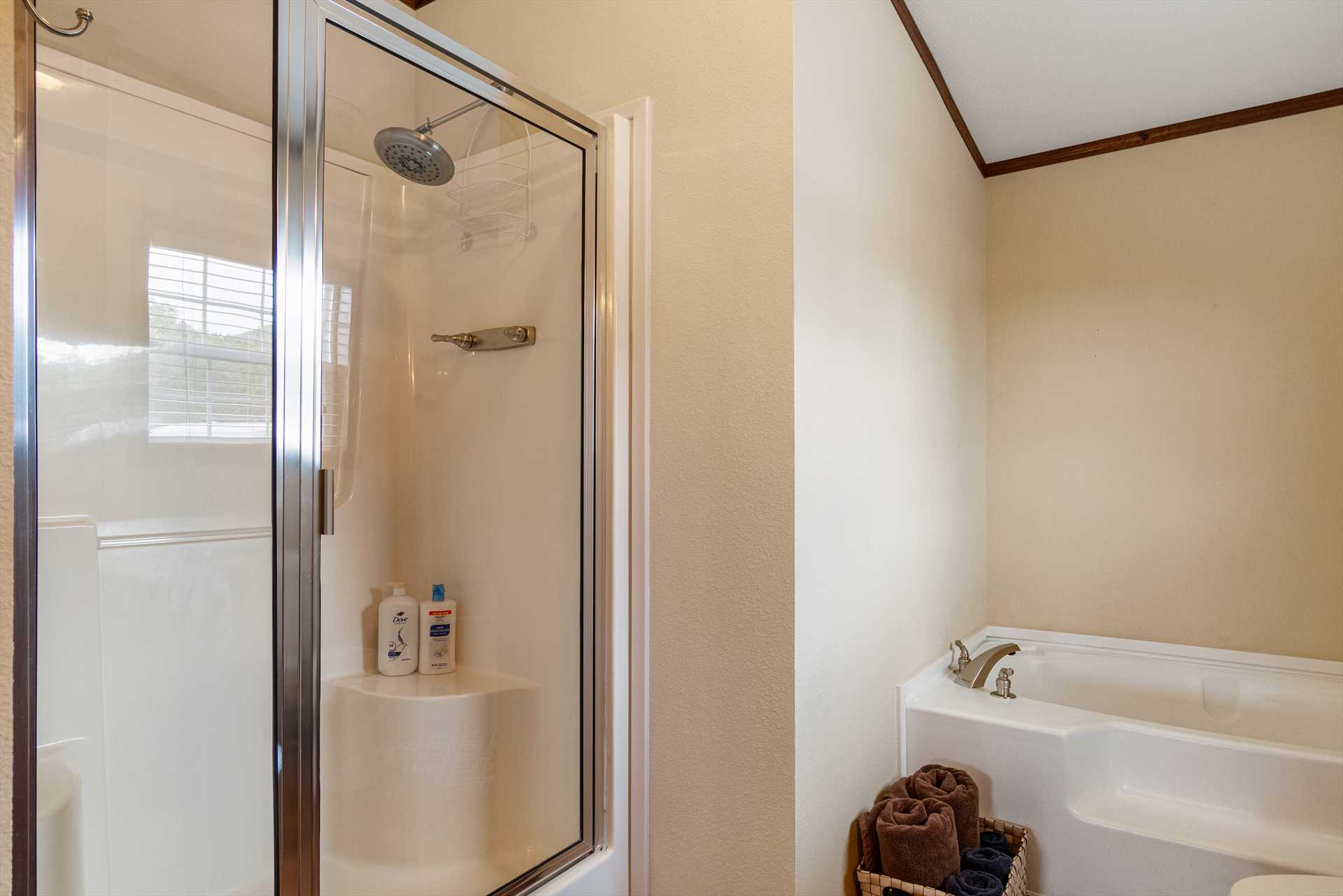                                                 A roomy shower stall and garden-style tub are the centerpieces of the full bath in the master suite!
