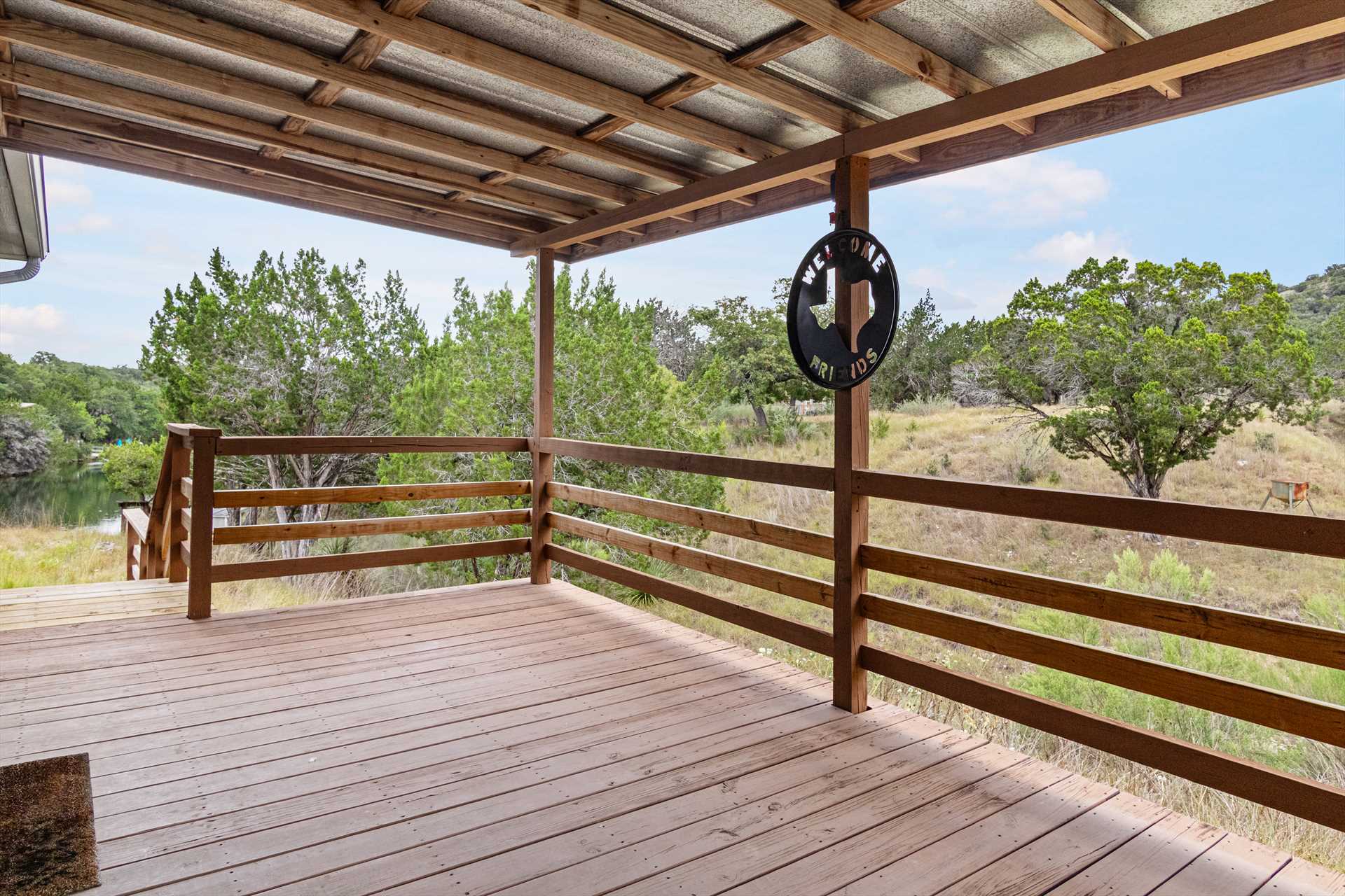                                                 The shaded front deck at the Hondo Creek Hideaway is not only spacious, but it opens up to some amazing Hill Country views!