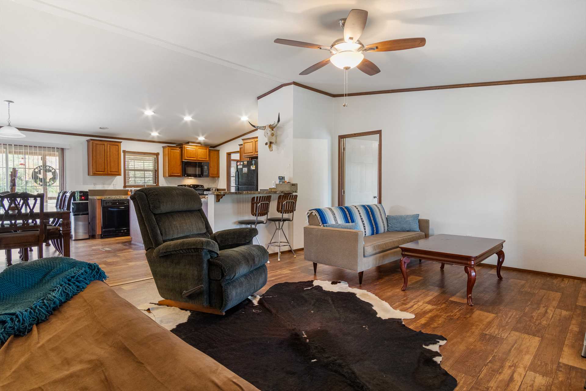                                                 The open floor plan here allows plenty of space for everyone, and no matter where you are you'll be part of the fun!
