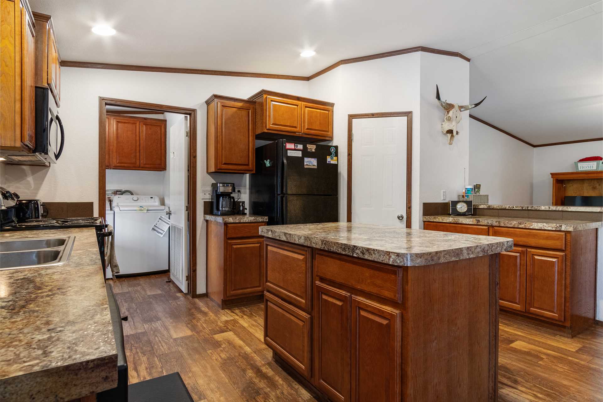                                                 With a great big central island and plenty of counter and floor space, there's no bumping elbows in the Hideaway's roomy kitchen!